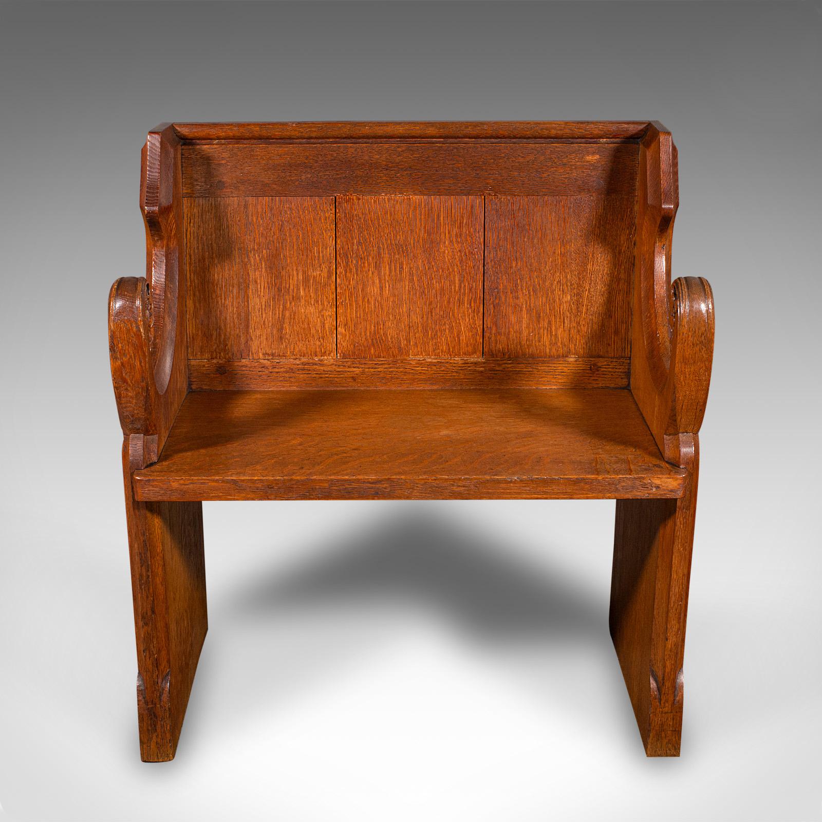 This is an antique hallway settle. A Scottish, oak two seat bench or ecclesiastical pew with Gothic revival taste, dating to the Victorian period, circa 1870.

Fine example of Scottish Gothic craftsmanship, with rich colour and distinctive