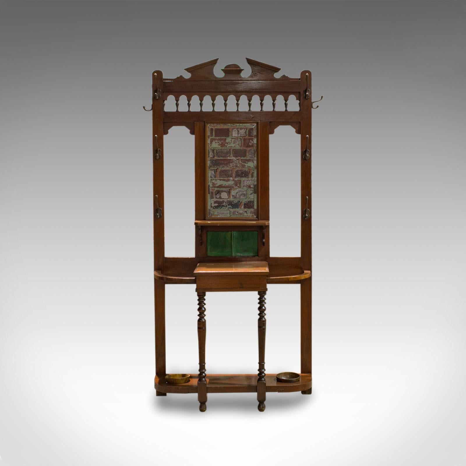 This is an antique hall stand. An English, walnut stick, coat or hat stand and dating to the Edwardian period, circa 1910.

Classic taste and highly versatile
Displays a desirable aged patina
Walnut shows fine grain interest and rich caramel