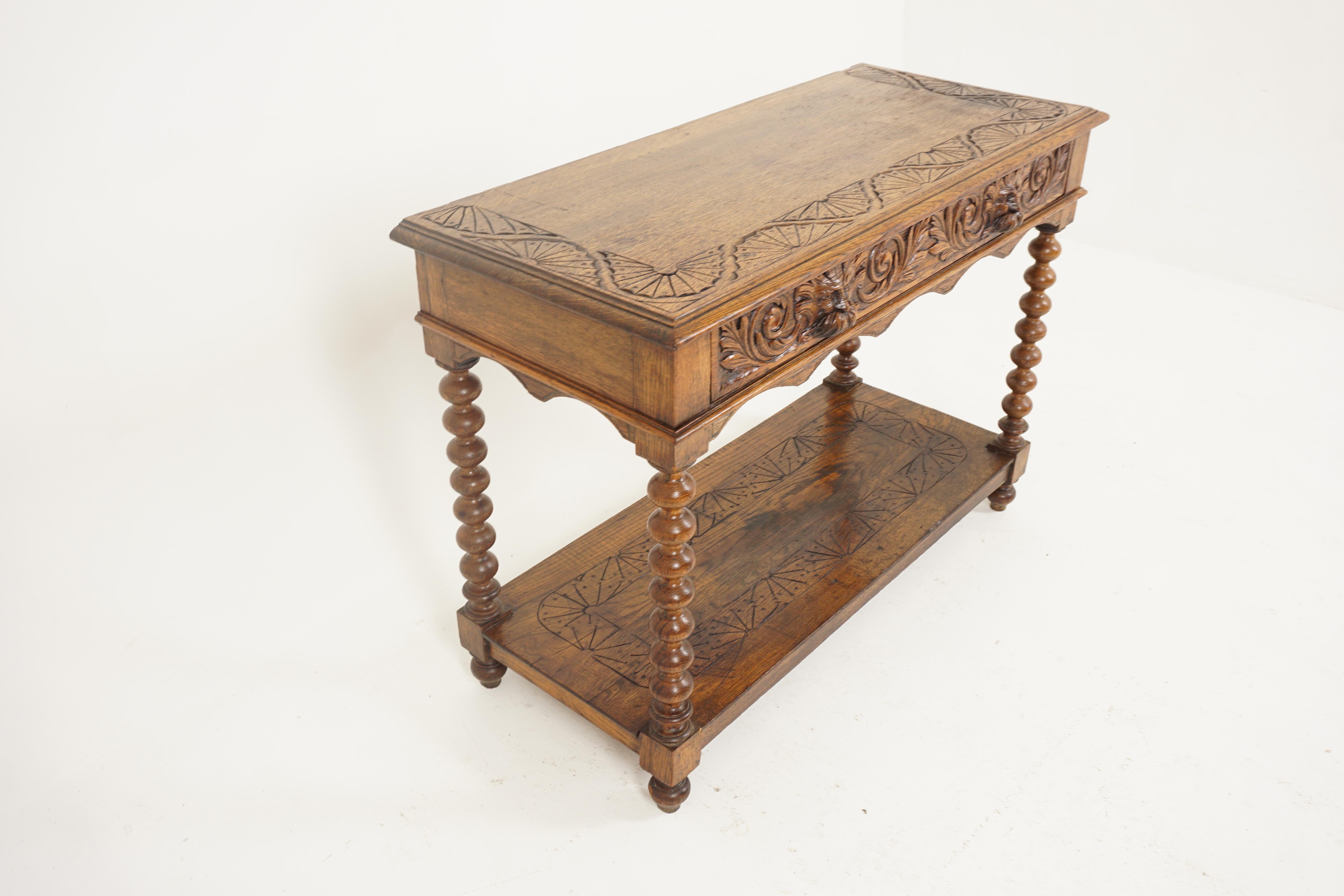 Antique hall table, oak server, green man, Scotland 1880, B2662

Scotland 1880
Solid oak
Original finish
Rectangular moulded top 
Pair of carved drawers with green handles 
Raised on bobbin legs with under tier shelf below
Nice color 
Some