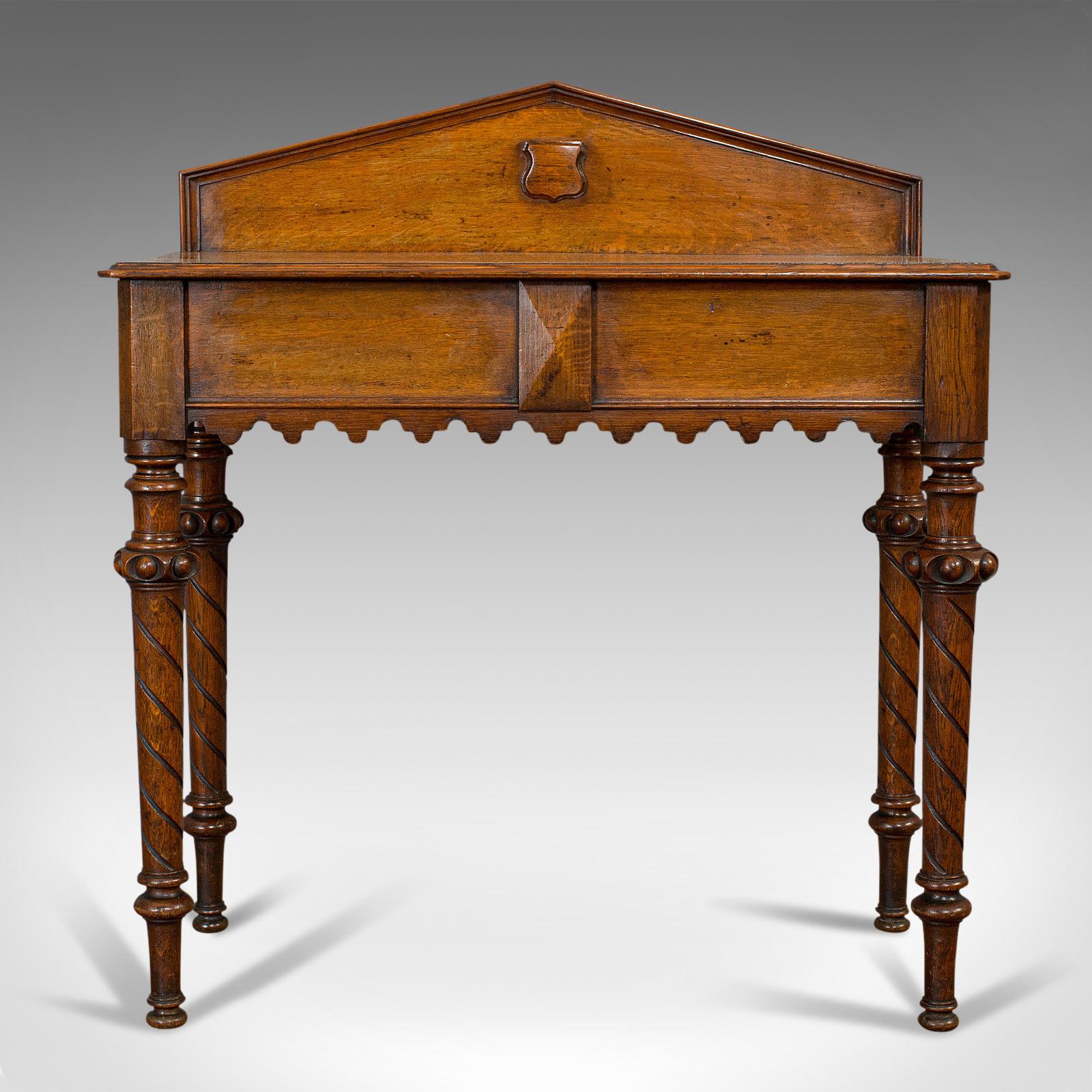 This is an antique hall table. A Scottish, oak Victorian Gothic revival side table or dresser, dating to the mid-19th century, circa 1860.

Appealing Scots table with Gothic revival taste
Displays a desirable aged patina
Select oak with