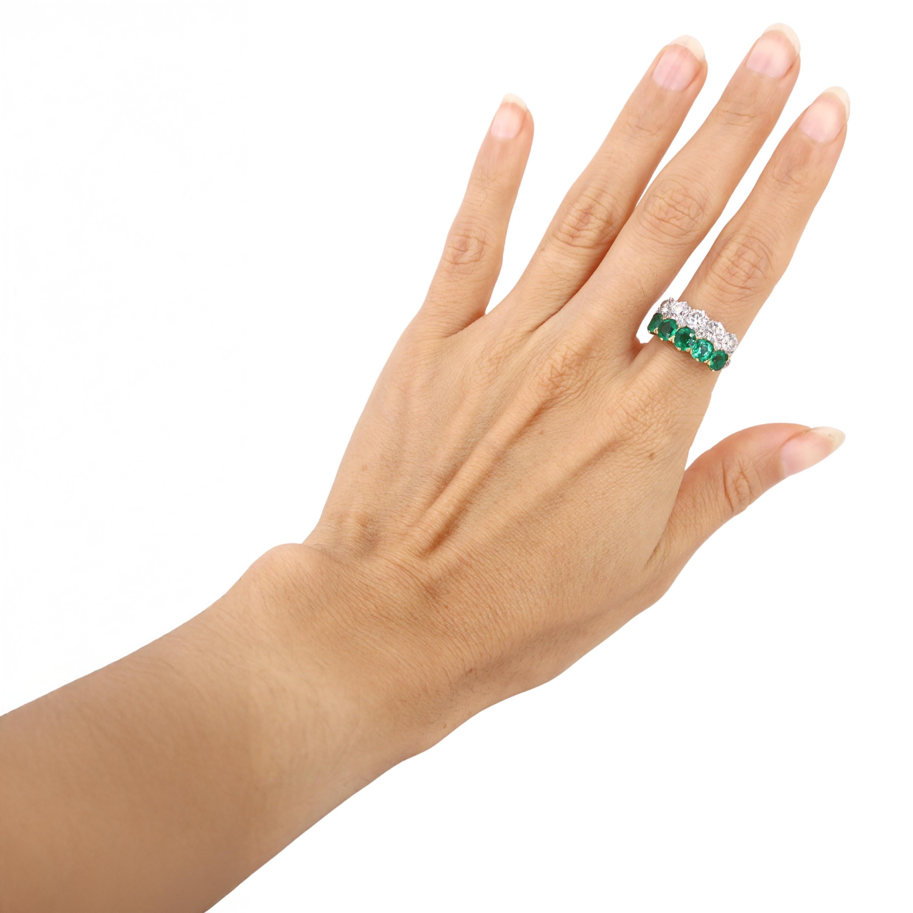 This exceptional antique ring is beautifully crafted in platinum and 18kt yellow gold, featuring a graceful alternating pattern of five natural old European cut diamonds (totaling 2.00 carats, F-G color, VS1 clarity) and five natural old oval cut