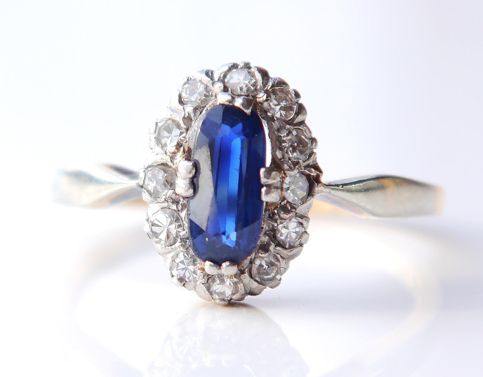 Halo ring featuring oval cut natural Blue Sapphire and 12 old European diamond cut diamonds mounted into White Gold or Platinum clusters. All stones have open backs. Hallmarked 585 , European, likely German made ca.1920s -1930s.

The crown is 12 mm