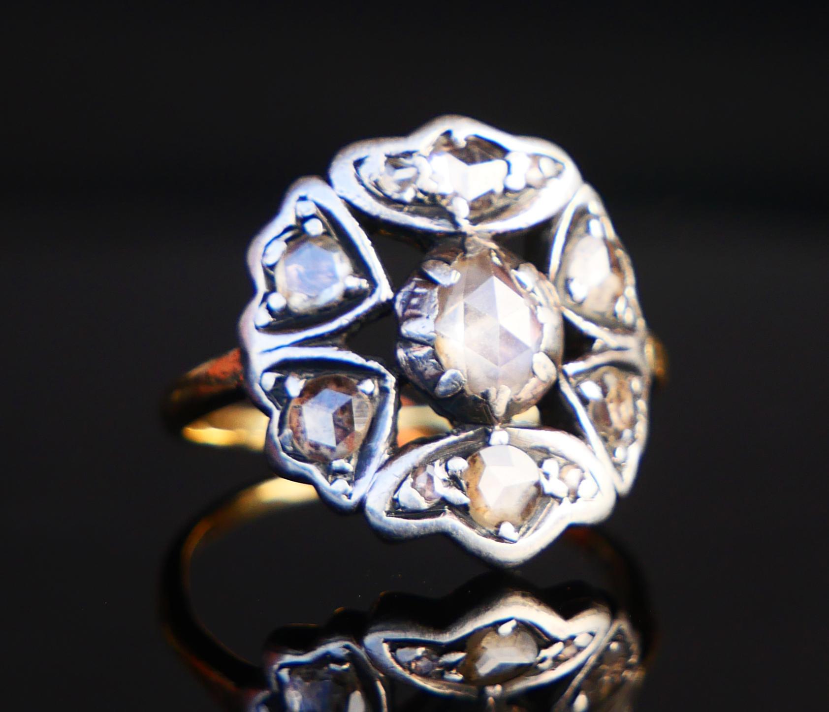 Ca. 1900s -1920's hand- made Halo Ring with Diamonds. Band in solid 18K Yellow Gold. Openwork Crown is a bit convex shaped for best fit on a finger with top part.clusters in Silver holding 7 natural rose cut Diamonds. Swedish early 20th century