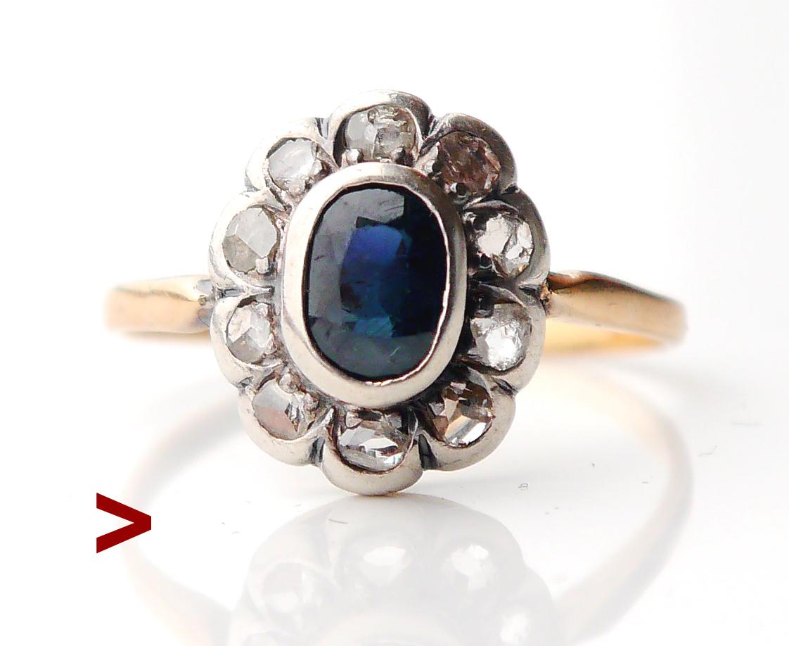 Finales del siglo XIX-principios del XX. Anillo Halo alemán con zafiro verde azulado natural y 10 diamantes talla rosa antigua.

Hallmarked 18K (probado) .

La Corona de Plata mide 12 mm x 10 mm x 5 mm de profundidad. Todas las piedras están