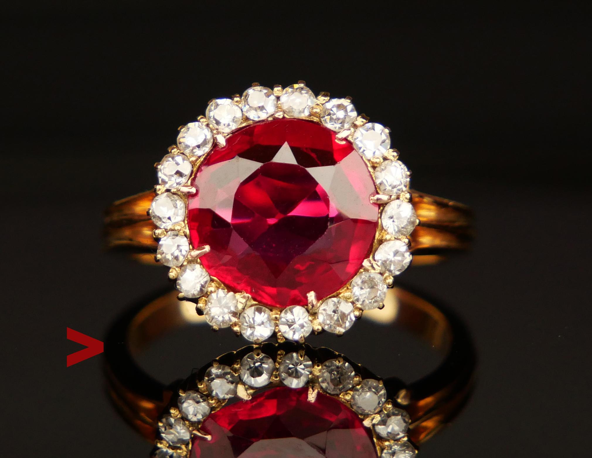 Halo Ring from ca .1920s -1930s with Ruby and 18 Diamonds. Not hallmarked, metal tested 14K.

Crown measures Ø 13 mm x 4.5 mm deep. Claw set Ruby is lab-made, old European cut 9.5 mm x 7.25 mm x 3.3mm / ca. 3.5 ct.

18 natural Diamonds of old