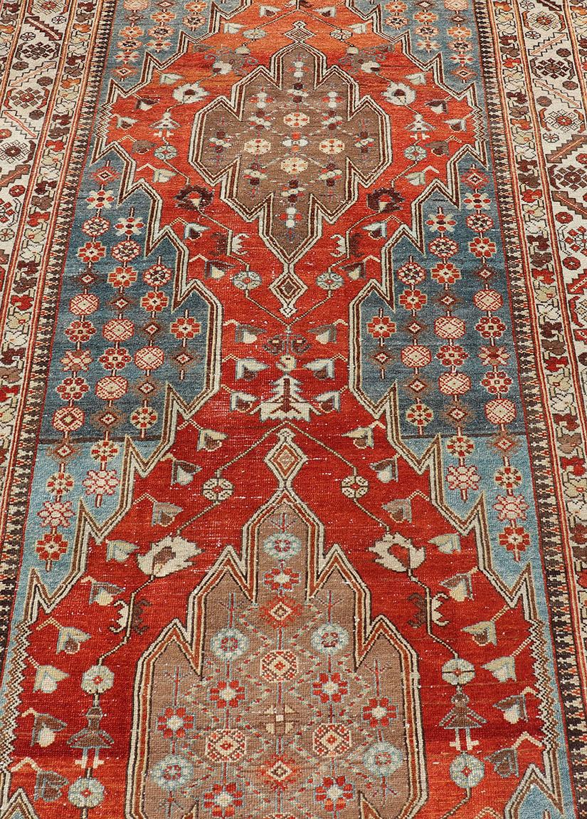 Persian Antique Hamadan Gallery Rug with Geometric Medallions in Red, Blue and Brown For Sale