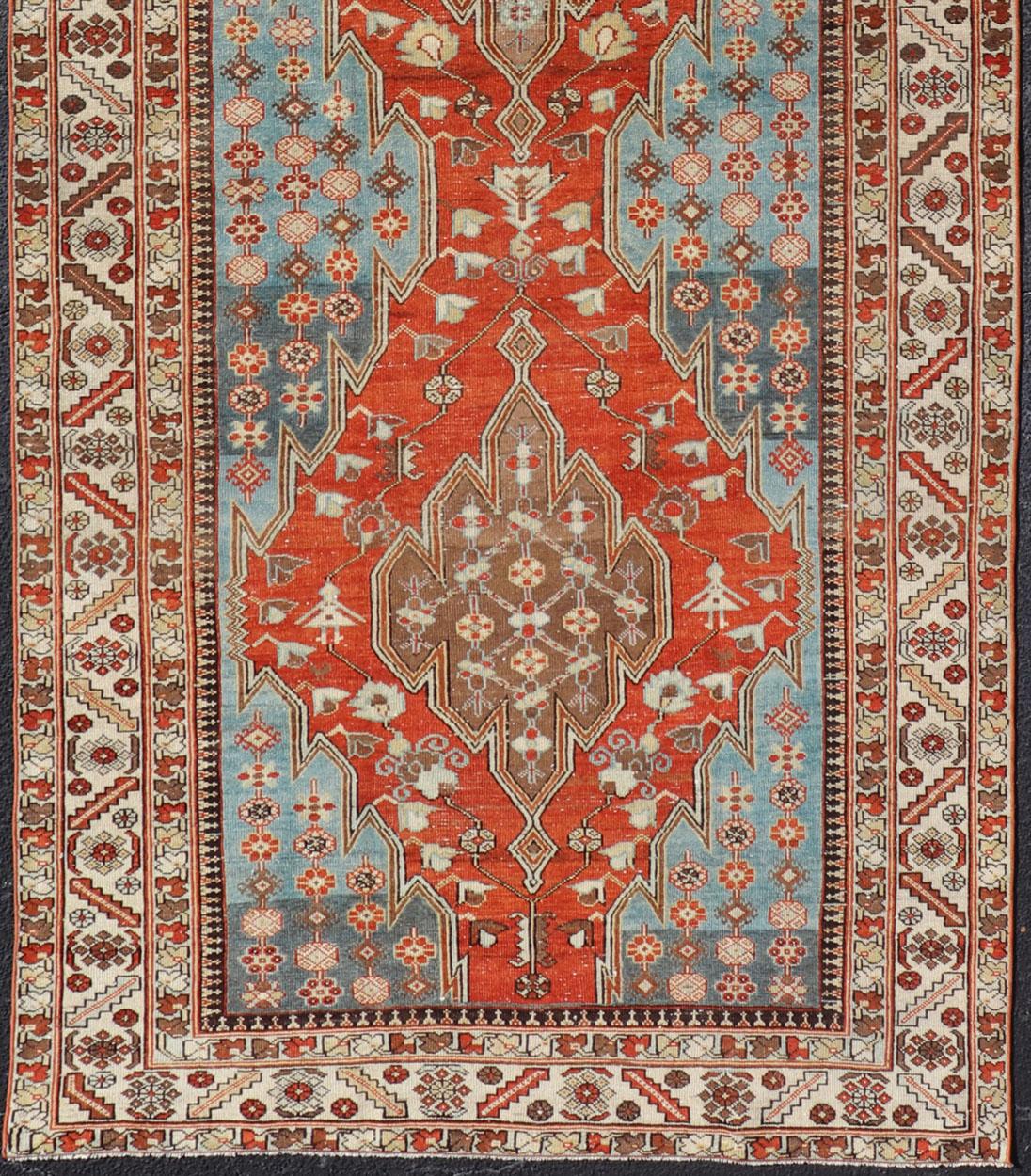 20th Century Antique Hamadan Gallery Rug with Geometric Medallions in Red, Blue and Brown For Sale