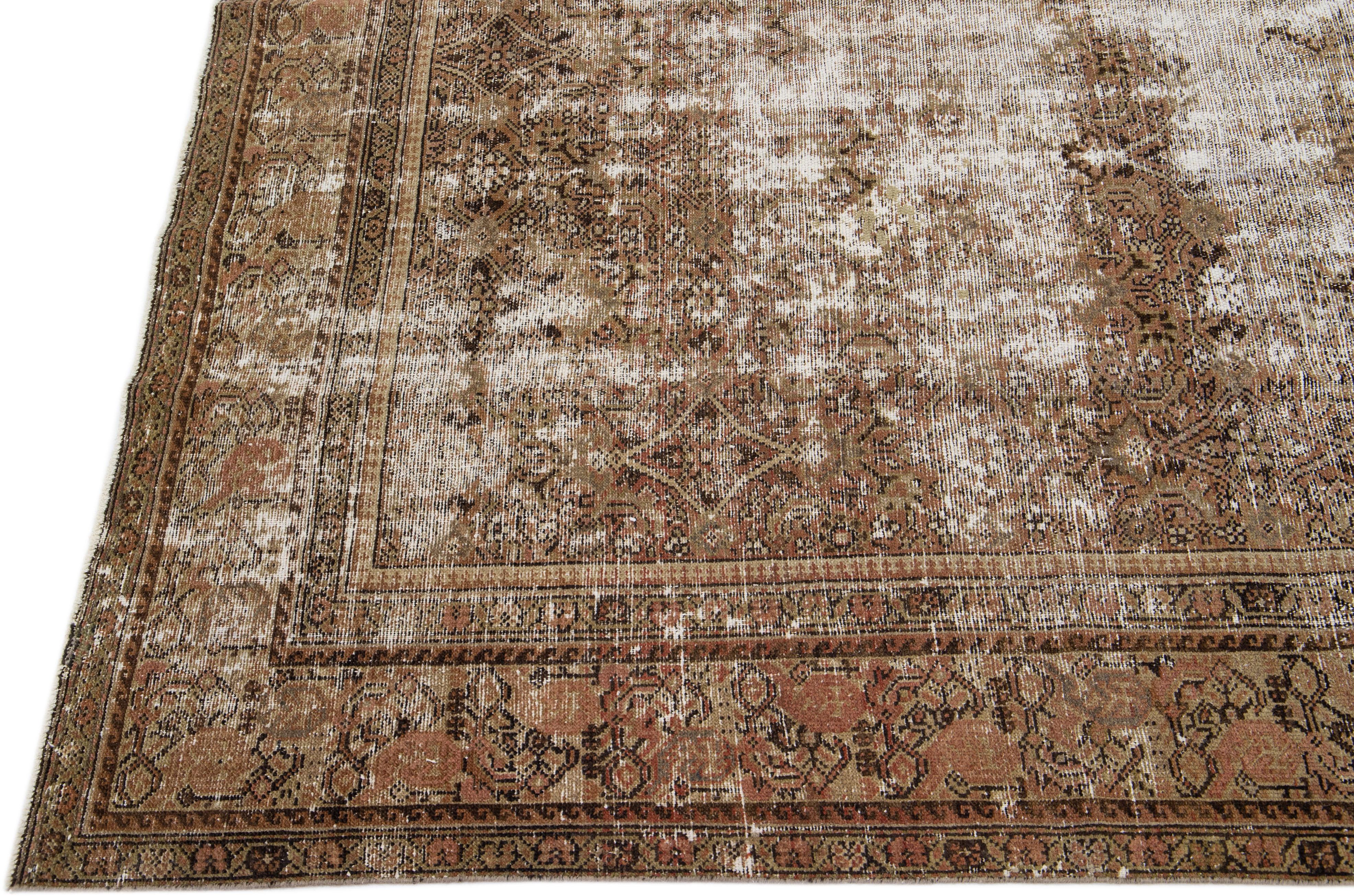 Persian Antique Hamadan Handmade Distresses Brown Wool Rug with Allover Design For Sale