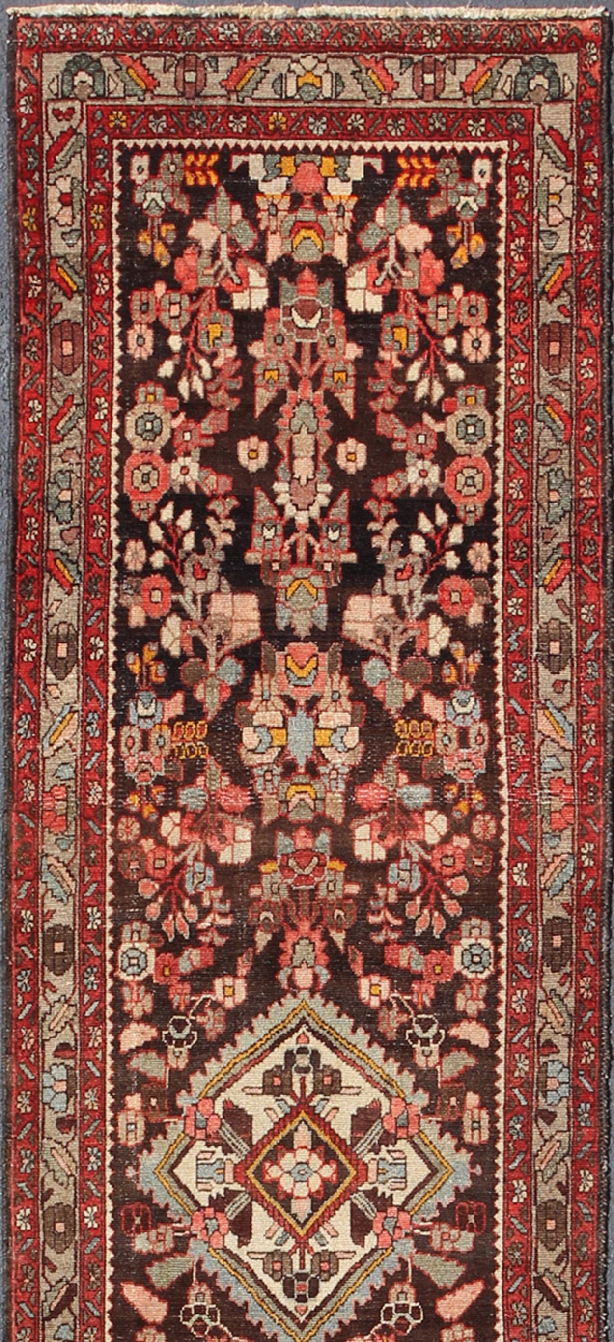 Antique Hamadan long Runner- H-702-17, antique Hamadan Runner-this semi antique Hamadan gallery runner (circa mid-20th century) features a unique blend of colors and an intricately beautiful design. The central medallions consist of a vertical line