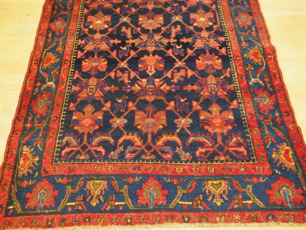 A good village rug from the Greater Hamadan Region with an floral lattice design
Circa 1920

The rug is a good example of the design found in Borodjert village which lies 120 km south of Hamadan city The use of blues with pink tones is typical of