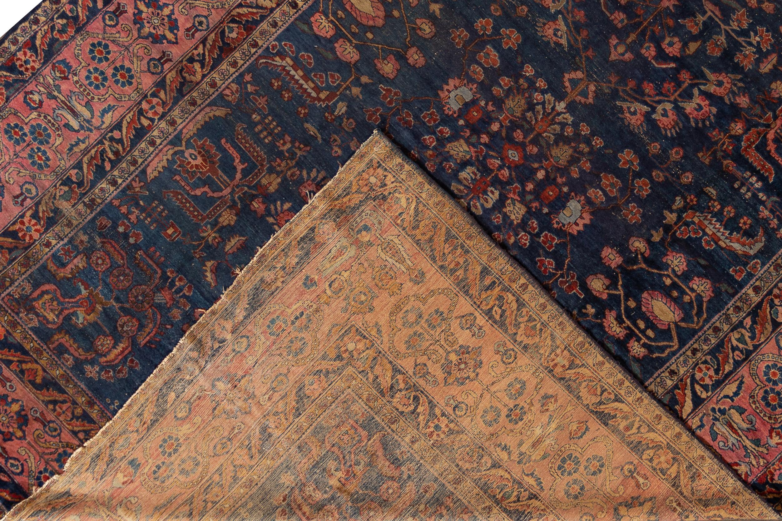 A hand knotted antique Hamadan rug with an all-over design. This rug measures 10'2