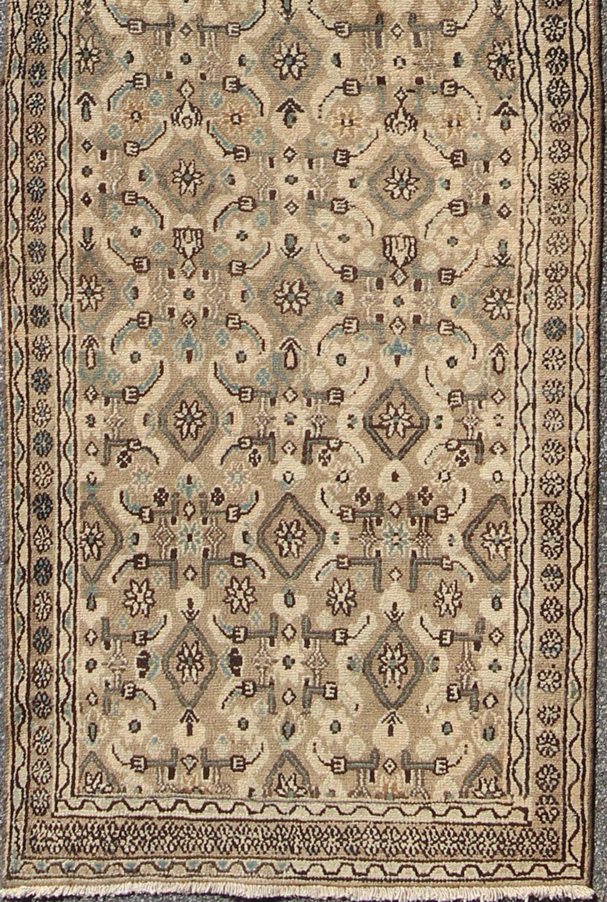 Antique all-over geometric design Hamadan runner in neutral tones of taupe, brown, gray, with a pop of light blue rug H-102-12, country of origin / type: Hamadan, circa 1930
This antique Hamadan runner features a Classic Herati design in warm earth
