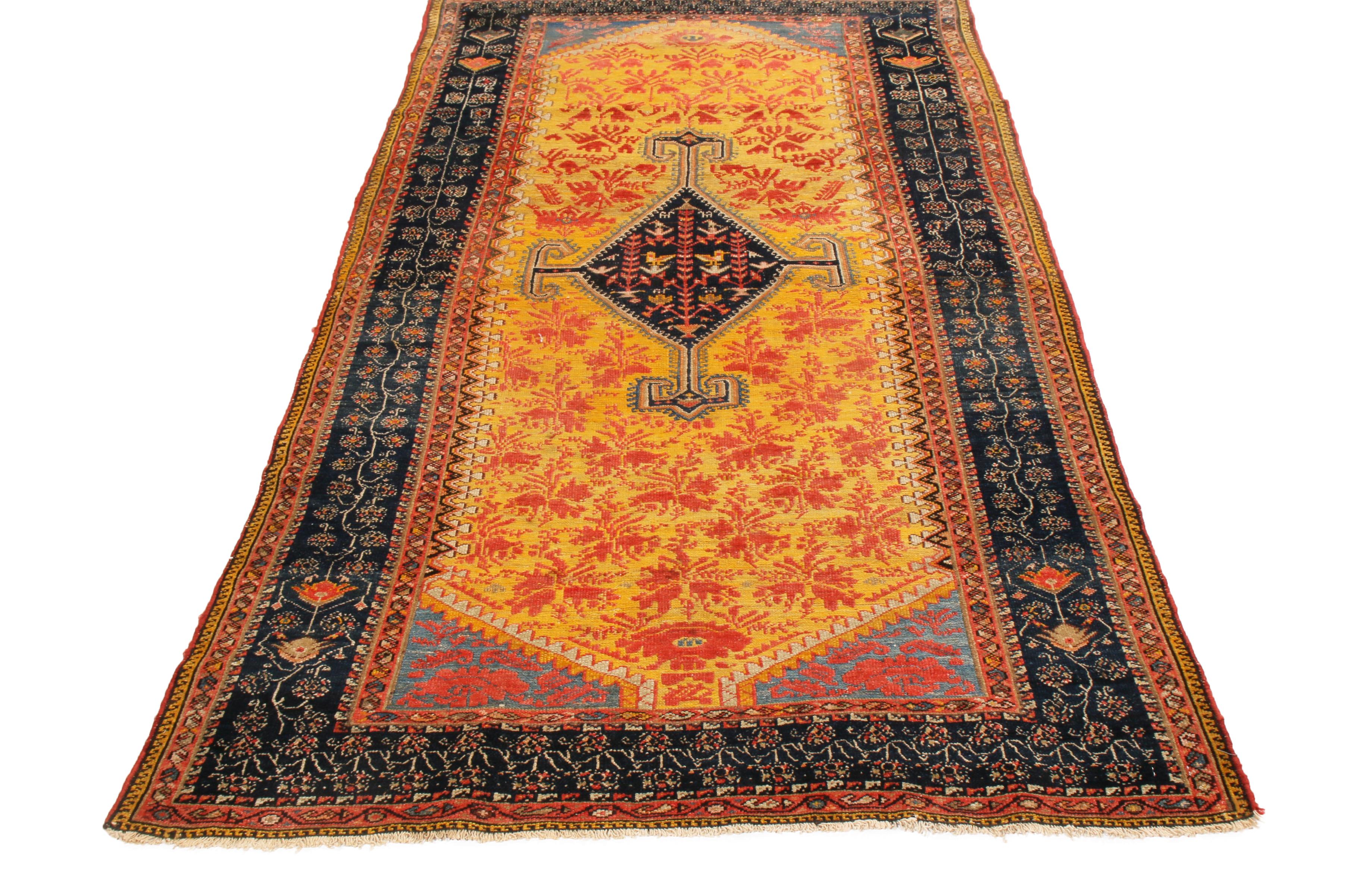 Originating from Persia in 1890, this antique traditional Hamadan Persian rug features a stylistically intriguing variation of the tree of life motif. A once iconic symbol of eternal life often used in rituals and commemorations, this piece’s fig