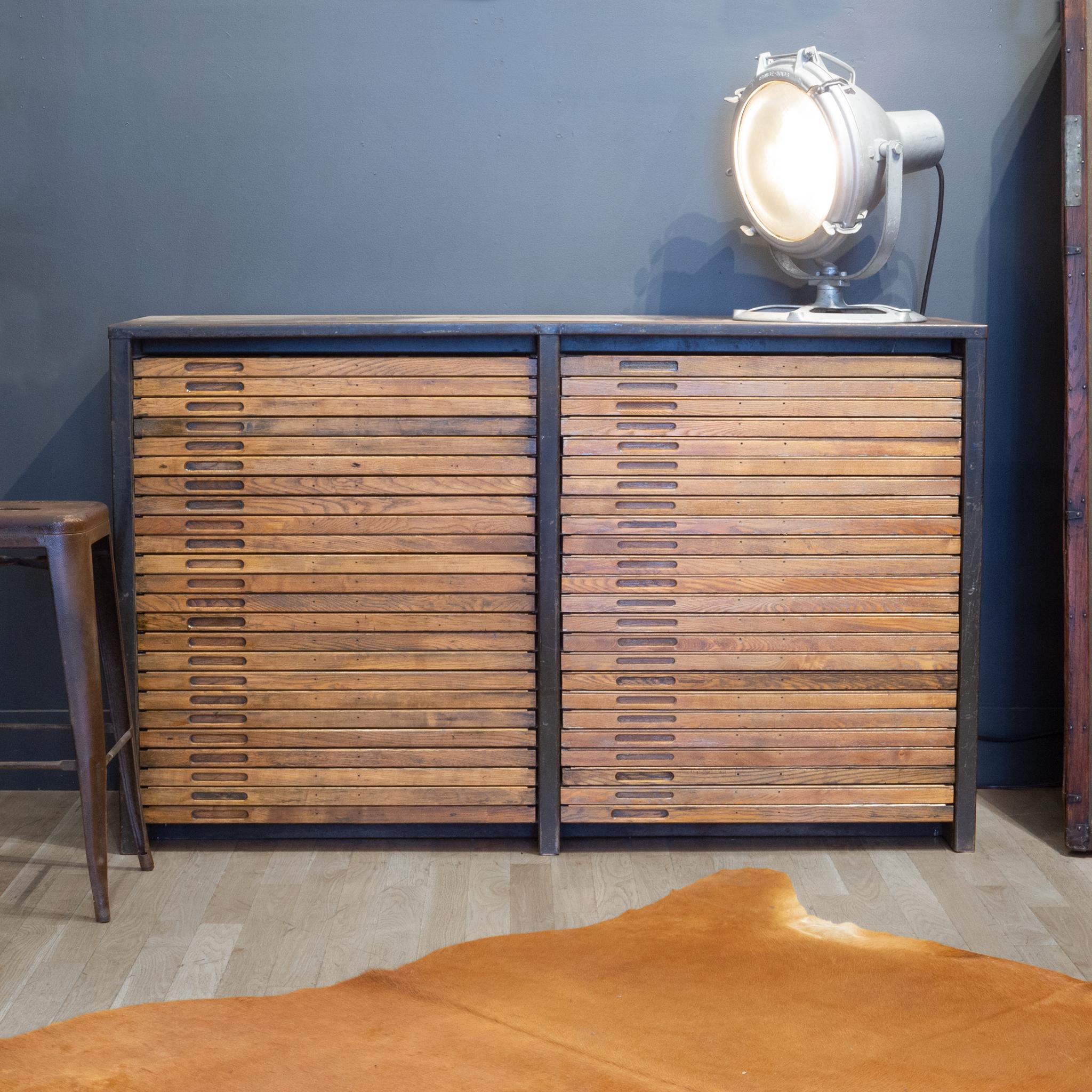 About

An early 20th century typesetter's cabinet by Hamilton Mfg Company with steel case and 48 wooden segmented drawers used to house steel typeset letters. Each drawer has label cutouts. The piece is structurally sound and has retained the