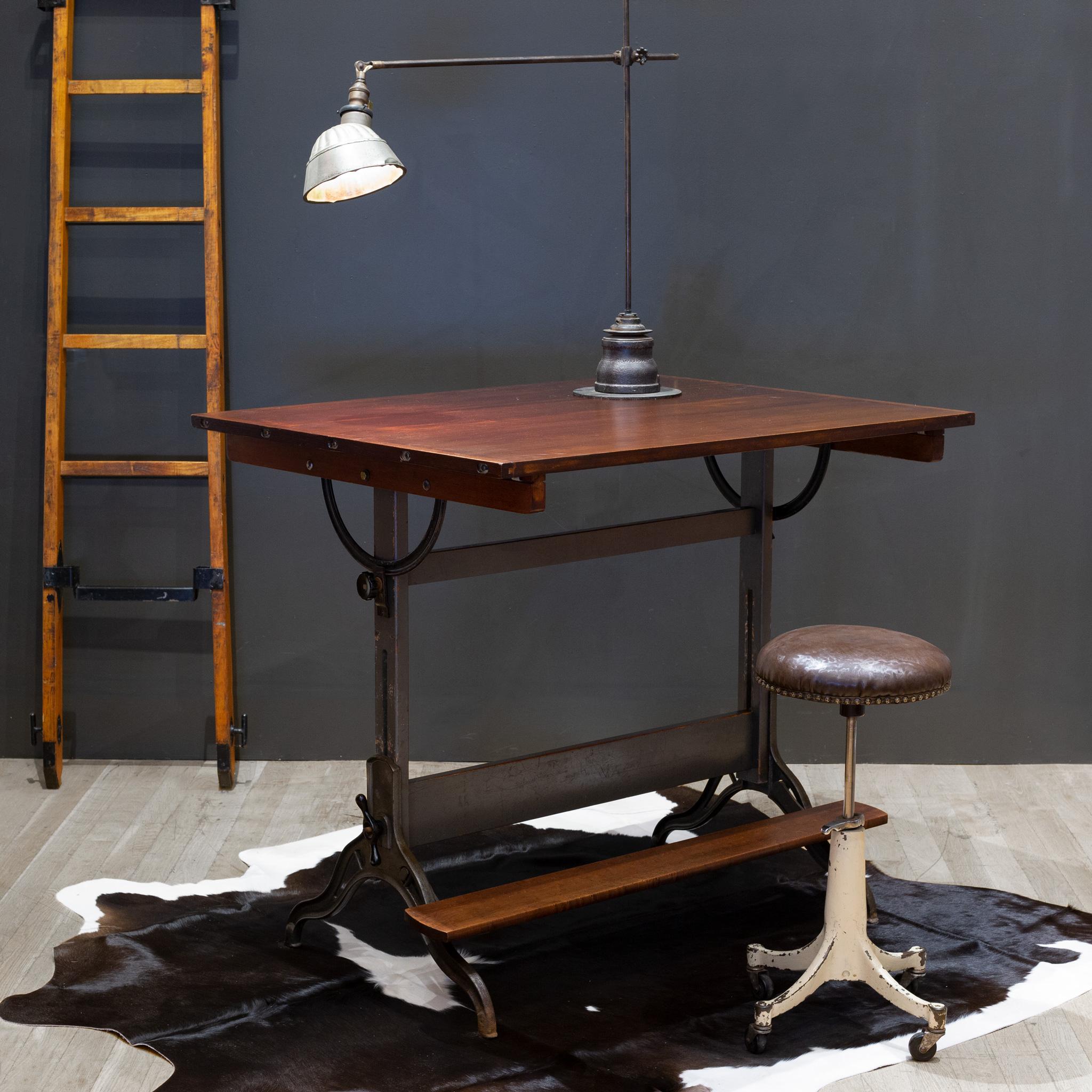ABOUT

Contact us for more affordable shipping options: S16 Home San Francisco. 

A fully adjustable industrial drafting table with solid Maple top, wooden base and solid cast iron black knobs. Original brass Hamilton Mfg. Co. label. Painted grey