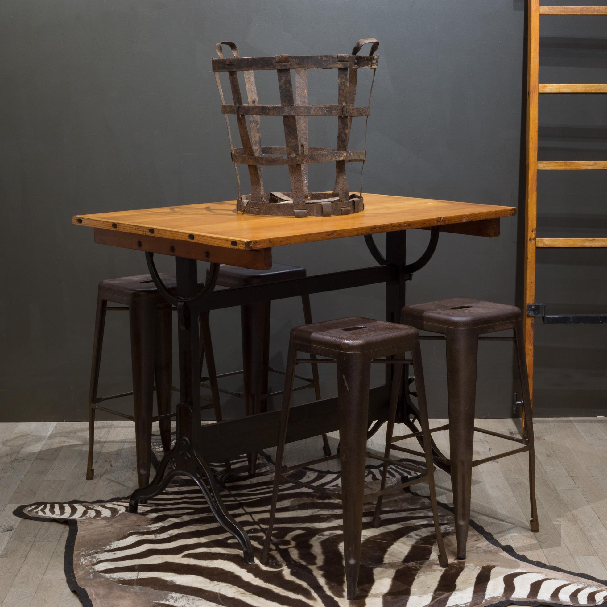 About

A fully adjustable industrial drafting table with solid wood top and cast iron base and knobs. The table can be used as a tall dining table, desk or drafting table. The top swivels at any angle and from either side. The whole table can be