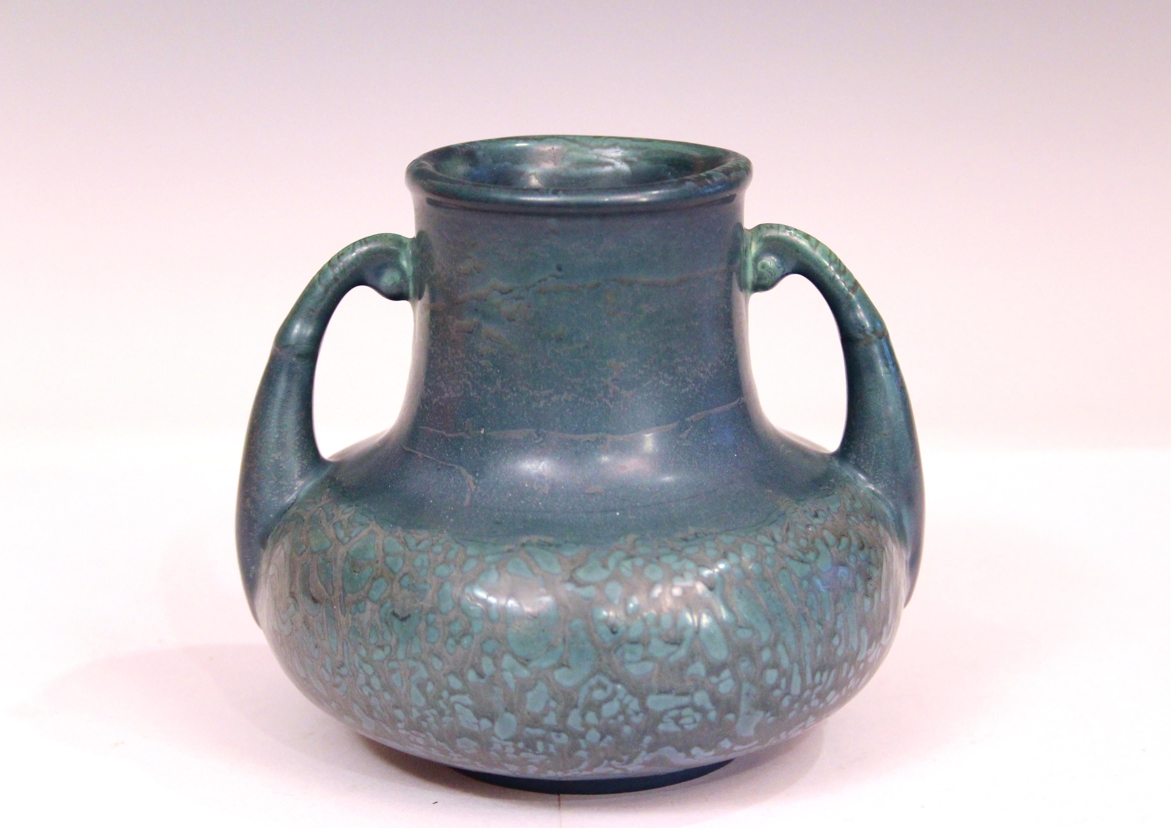 
Antique Arts and Crafts Hampshire Pottery curdled matt peacock blue vase with handles, circa 1910's. Form number 120. Clear, in mold signature. 4 3/4
