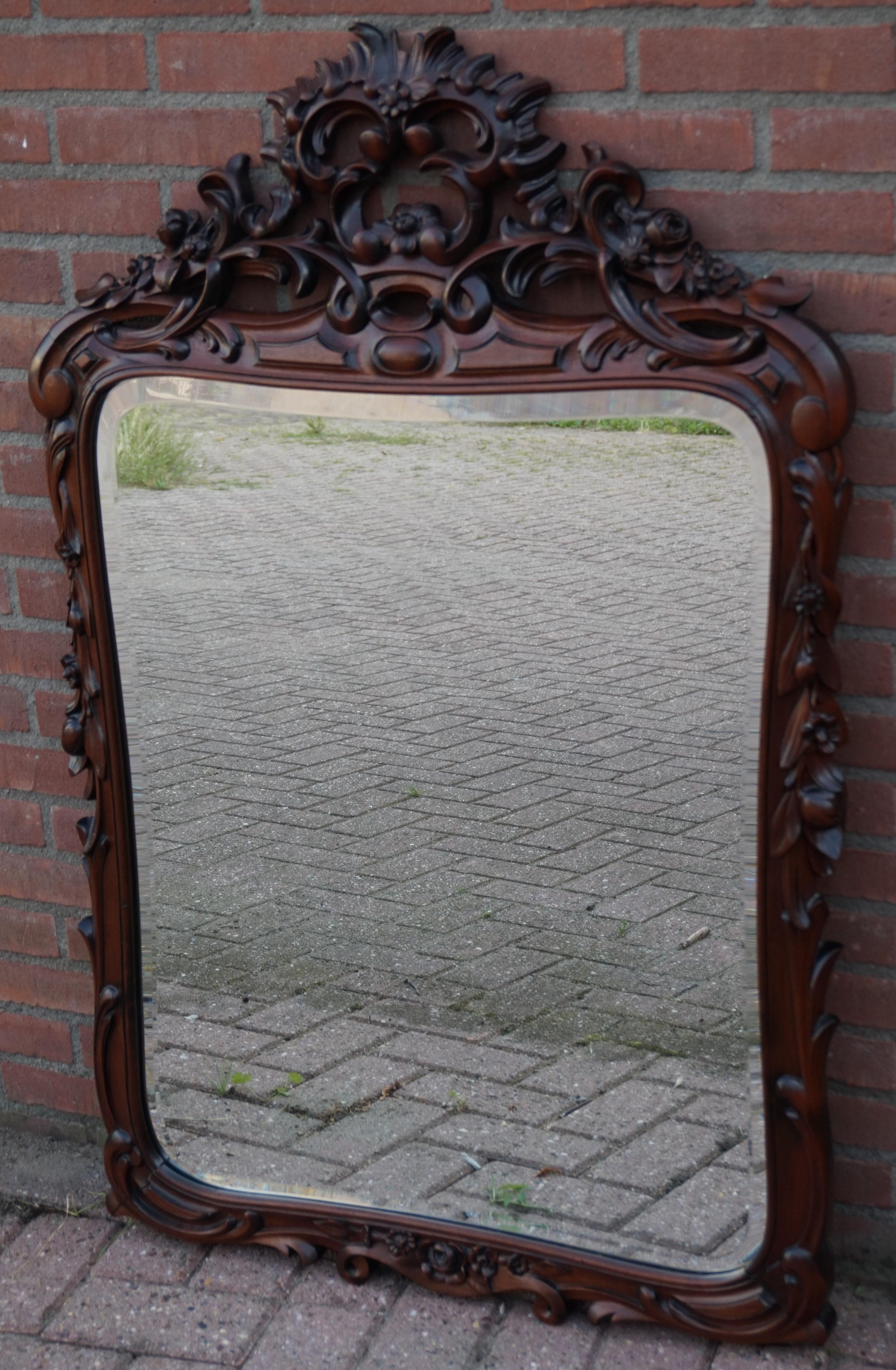 Perfect size and stunning antique wall mirror.

All handcrafted in the late 1800s this marvelous wall mirror would have graced the living space of a mansion of a very well to do family or individual. This incredibly well carved and highly stylish,