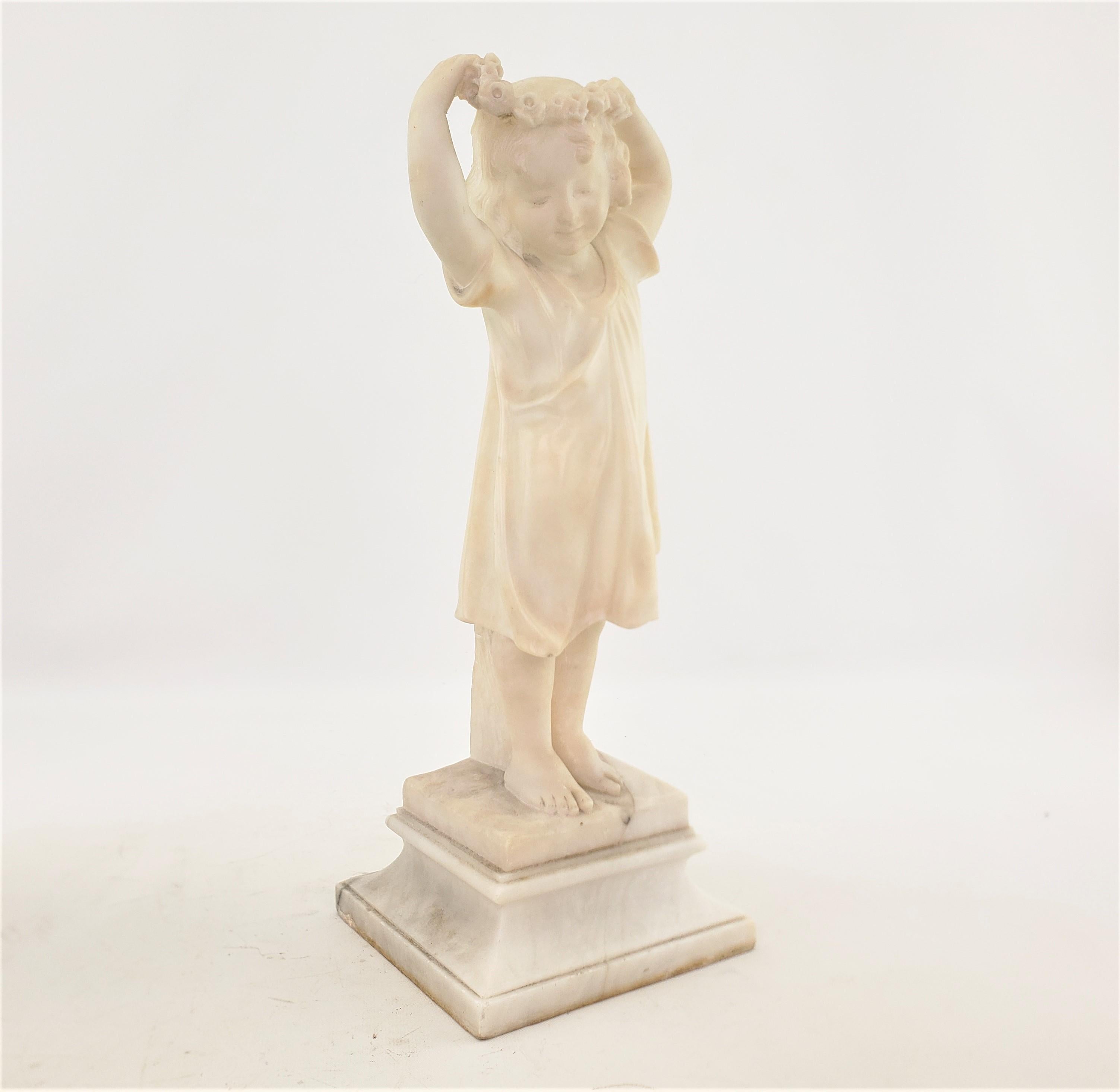 This well executed antique sculpture is unsigned, but presumed to have originated from Italy and date to approximately 1880 and done in the period late Victorian style. The sculpture is composed of alabaster and depicts a young girl straightening