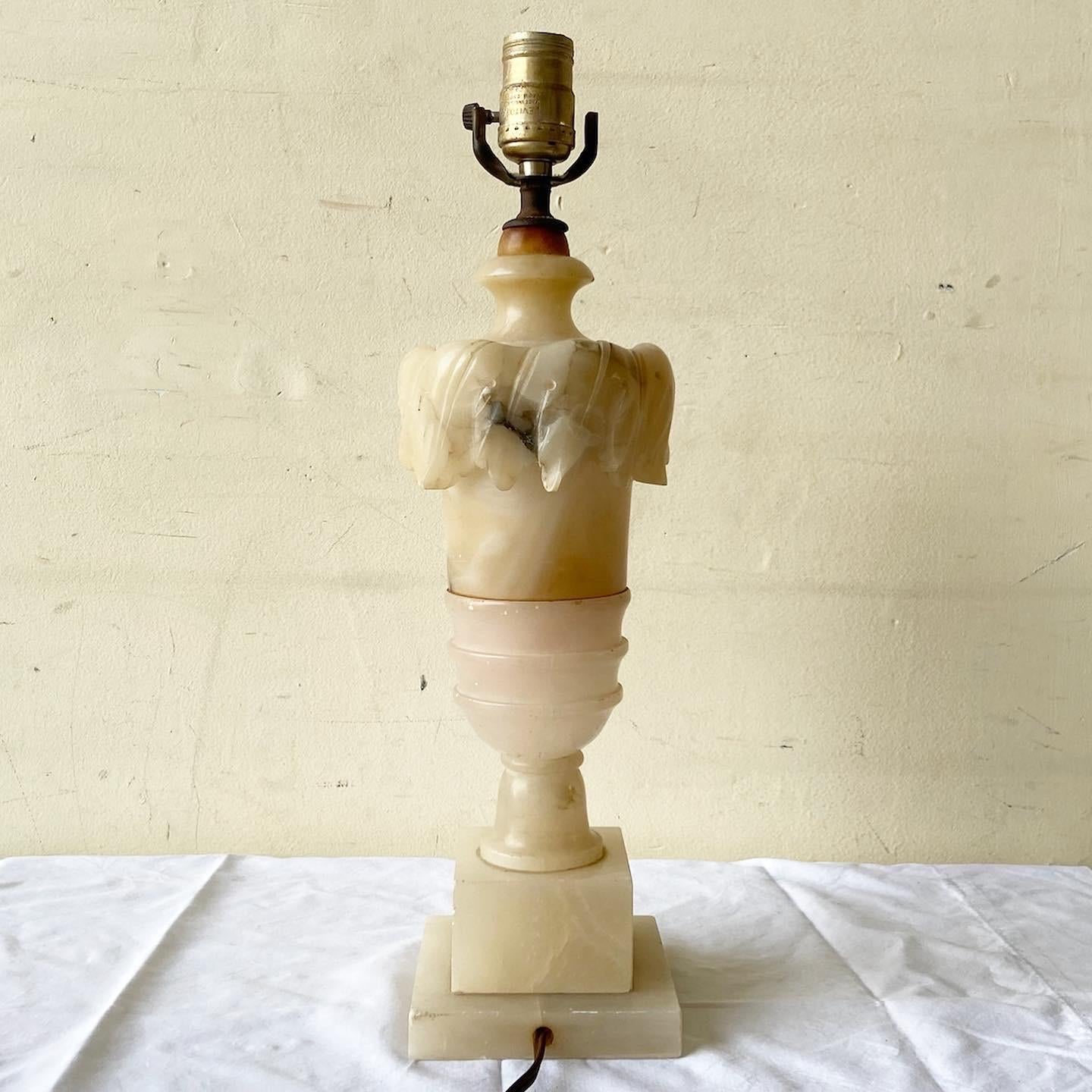 Rather notable early 20th century alabaster table lamp. Features a hand carved design throughout the lamp.
