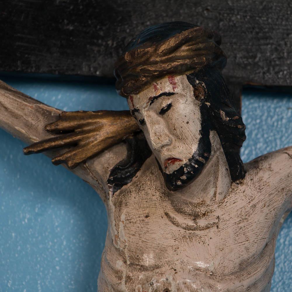 This large hand-carved and painted crucifix from Russia, still retains the original paint and Primitive appeal. Where the paint has been rubbed off, the natural pine is visible underneath. Please take a moment to enlarge the photos and examine the