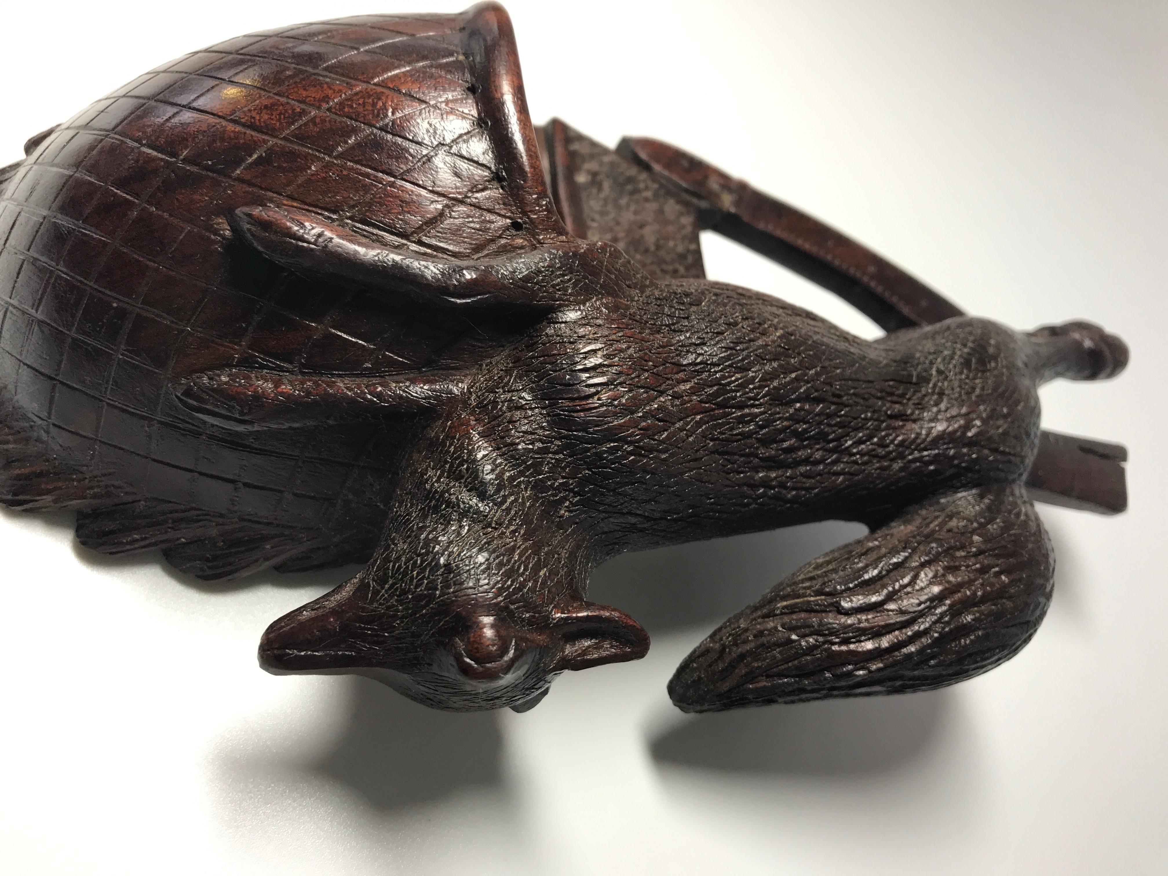 Black Forest antique hand carved miniature wall pocket of a game hunter's bag with draped fox.
Dark rich patina and super hand carved detailing
Hanging ring on reverse
Circa 1920
Measures: Height 8.5 inch, width 4.5 inch
In very good condition.