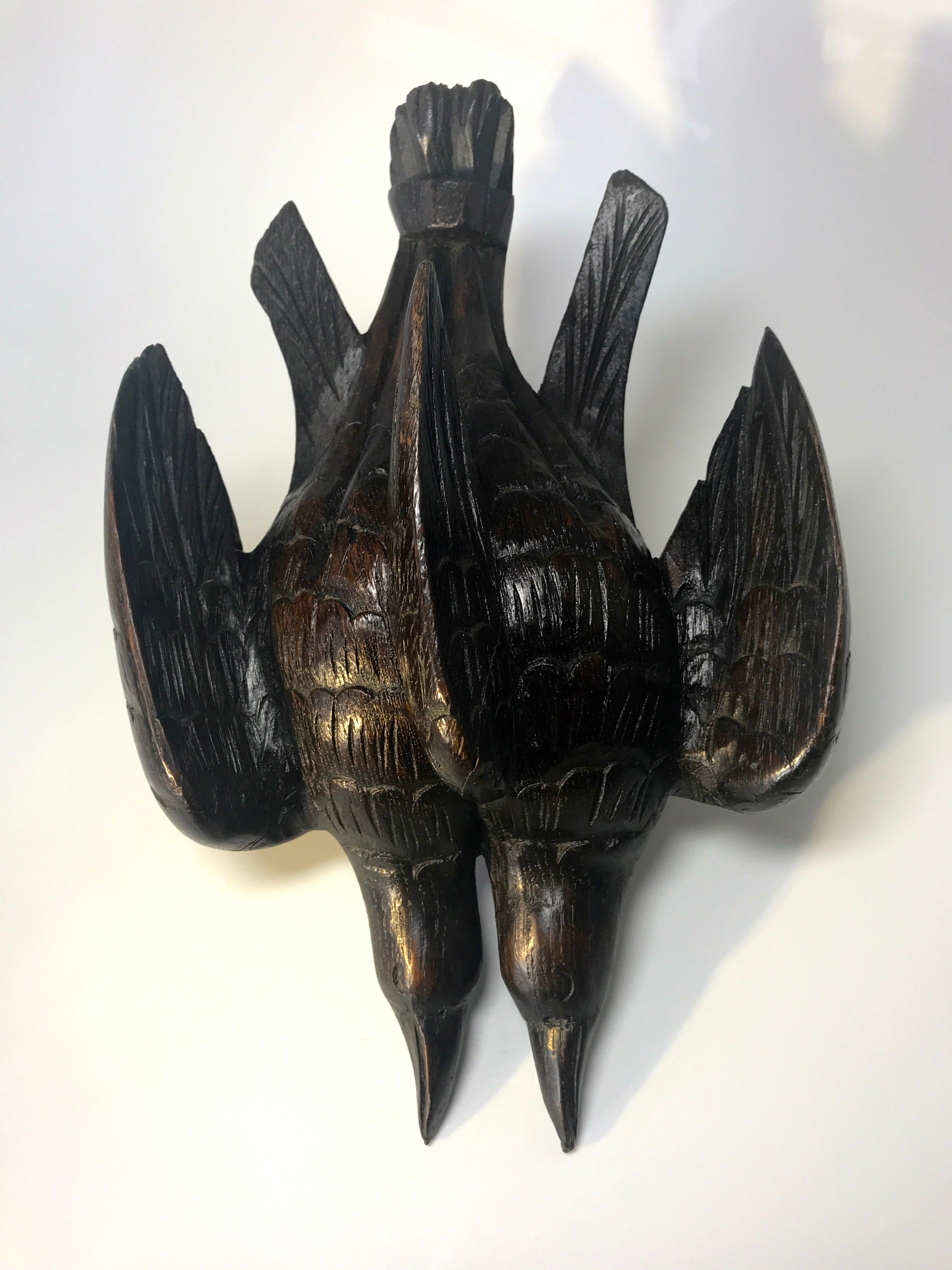 Antique Black Forest wall decoration of a pair of hand carved hunter's game birds hanging
Dark rich oak patina and super hand carved detailing
Hanging ring on reverse
circa 1920
Measures: Height 10.25 inch, width 7 inch
In very good condition.