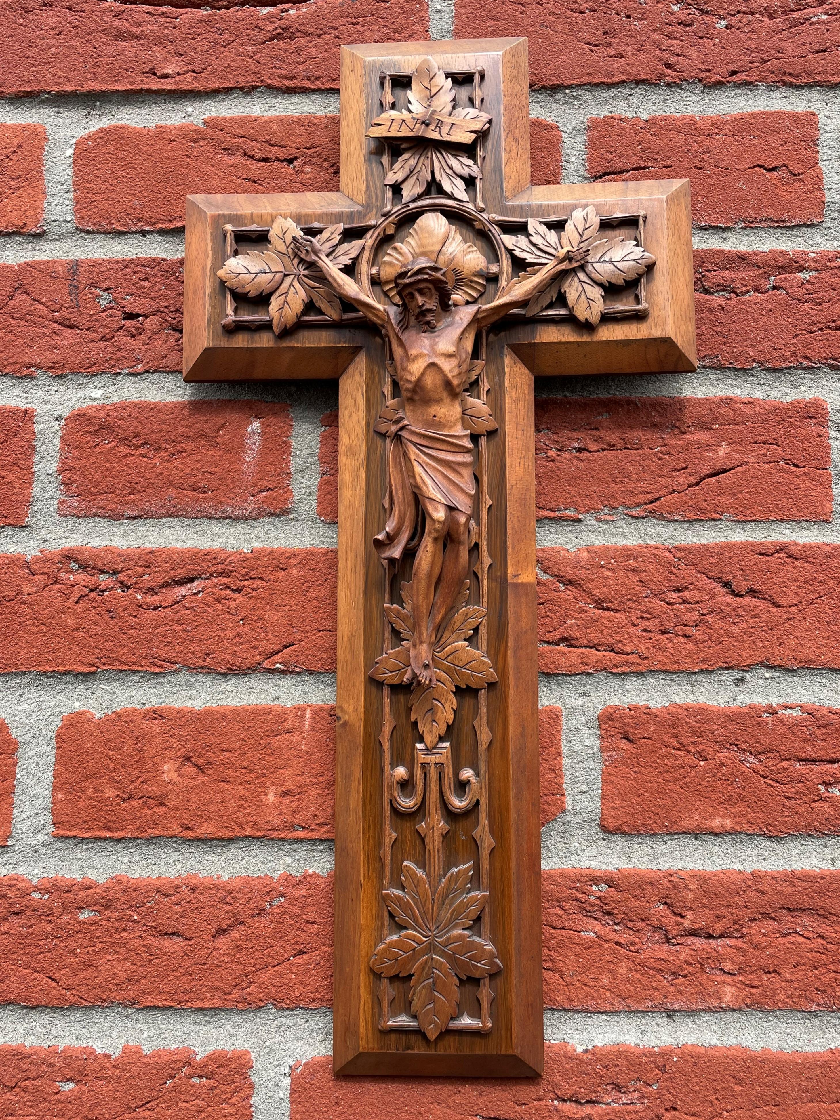 Amazingly hand carved black forest cross with matching size corpus and Gothic quatrefoil halo.

Over the decades we have sold a number of unique and interesting crucifixes, but we had not yet come across a branches and leaf entwined cross in the