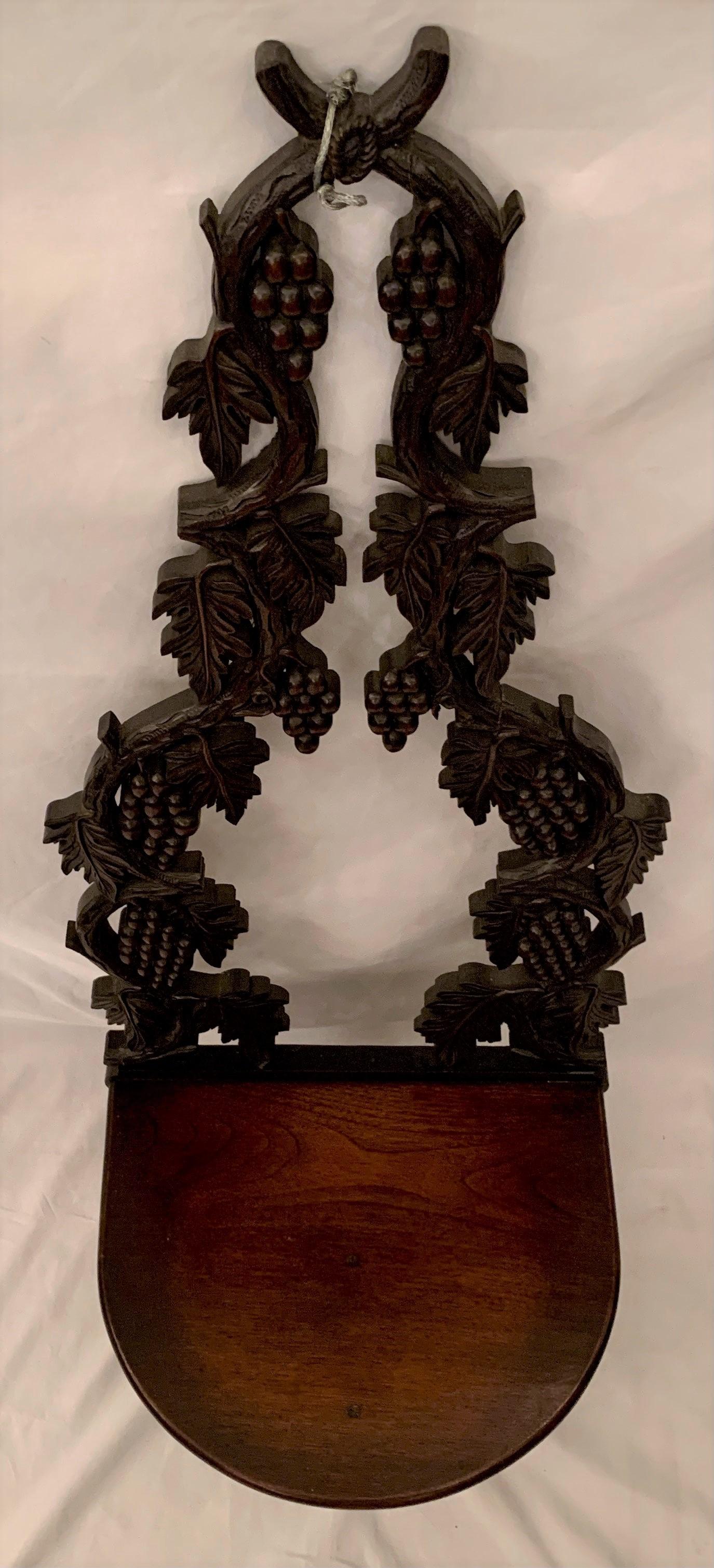 Antique hand carved black forest wooden wall shelf, circa 1880.