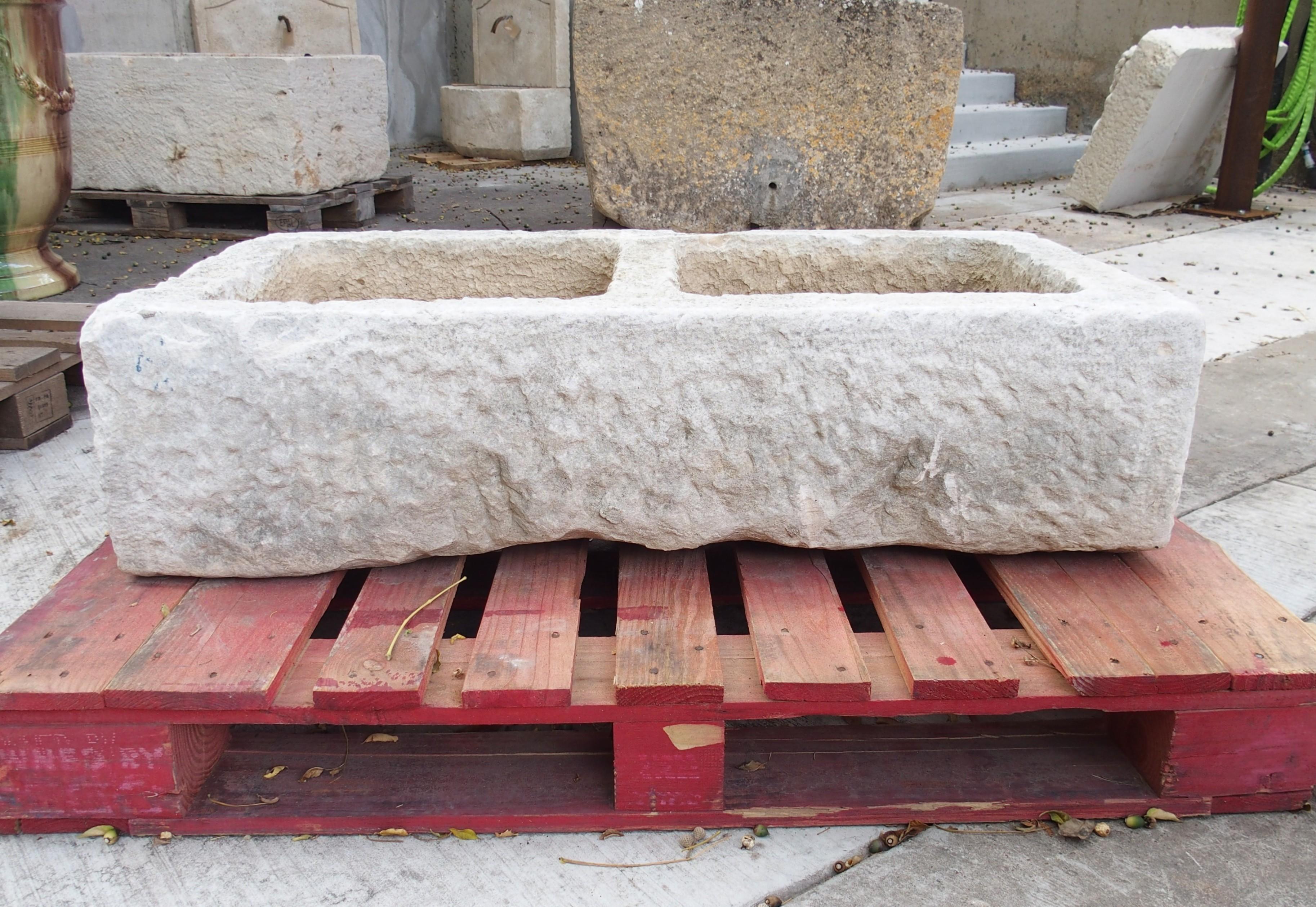 More information coming soon…

Hand-carved in the 1800s, this French double basin trough sink has ample character.  The stone has inherent cavitations, giving the top edges a porous appearance with undulations along the sides.  One of the basins is