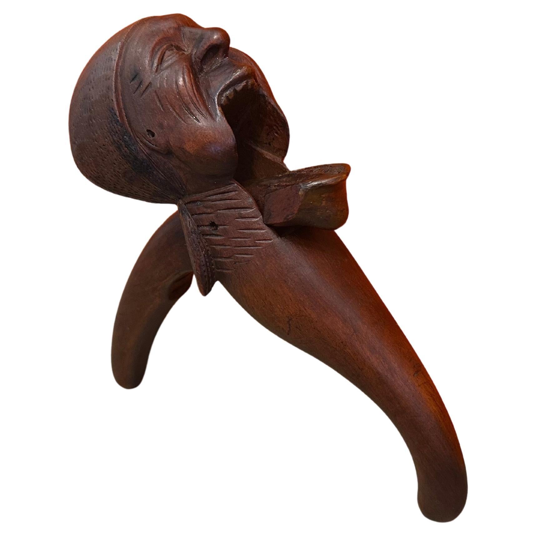 Wood Antique Hand Carved Early 20th Century Black Forest Nutcracker With Book For Sale