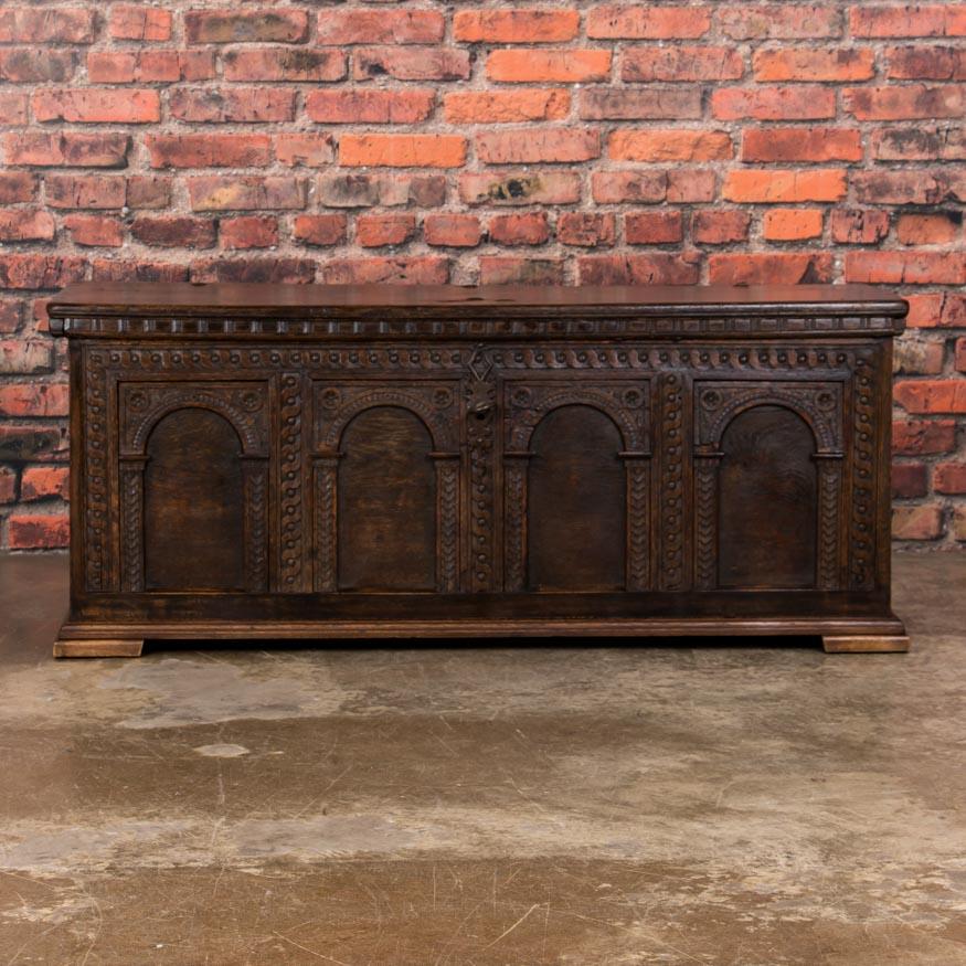 The elaborate carving that surrounds the arched panels adds decorative as well as architectural interest to this large German trunk, also called a coffer. Trunks and coffers were the general purpose storage of the day, while coffers usually had