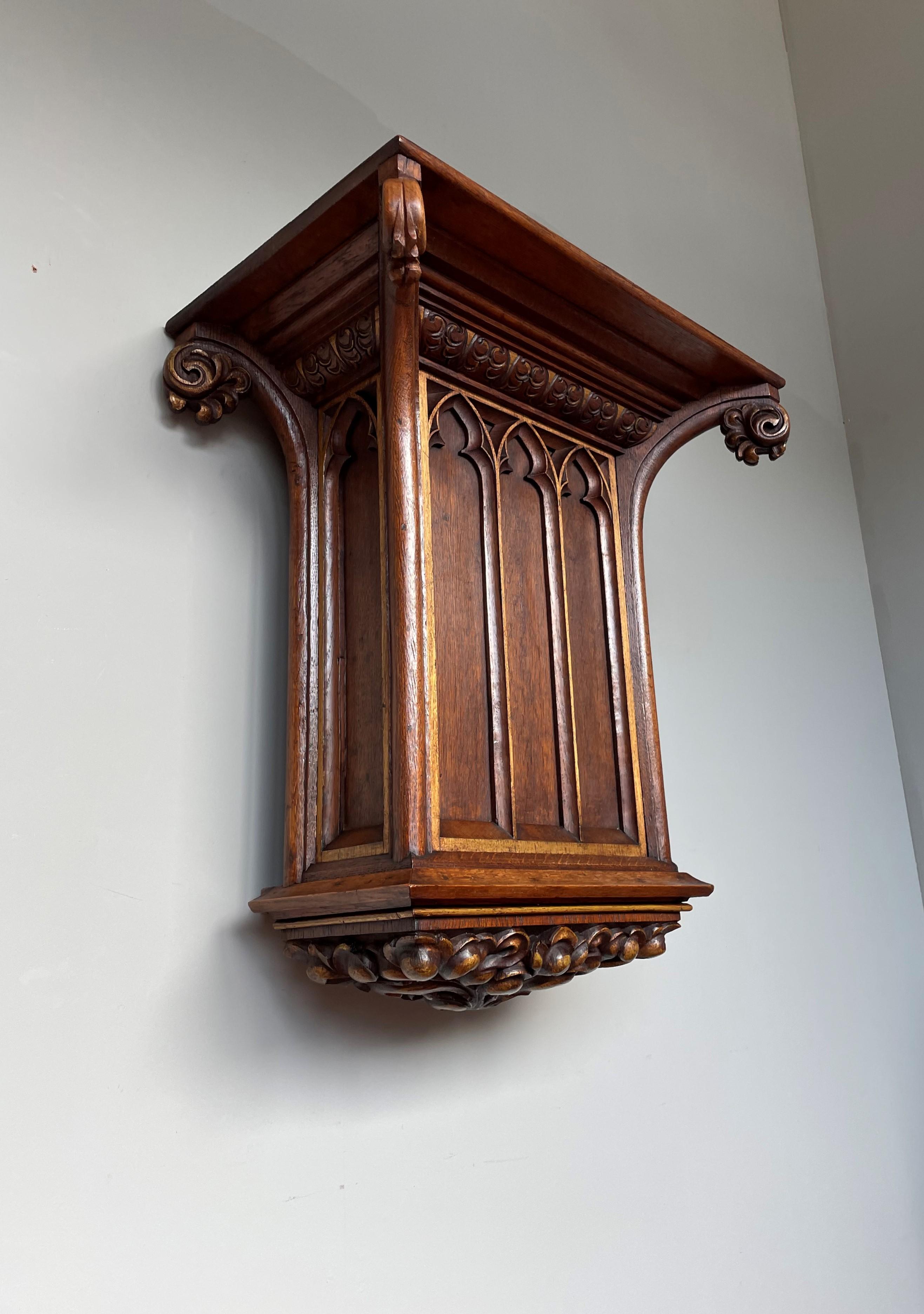 Large, partially gilt and great looking Gothic Revival bracket for displaying a Saint statue.

This Gothic console for wall mounting dates from the late 1800s and it has a marvelous combination of Gothic elements that make it a joy to own, to use