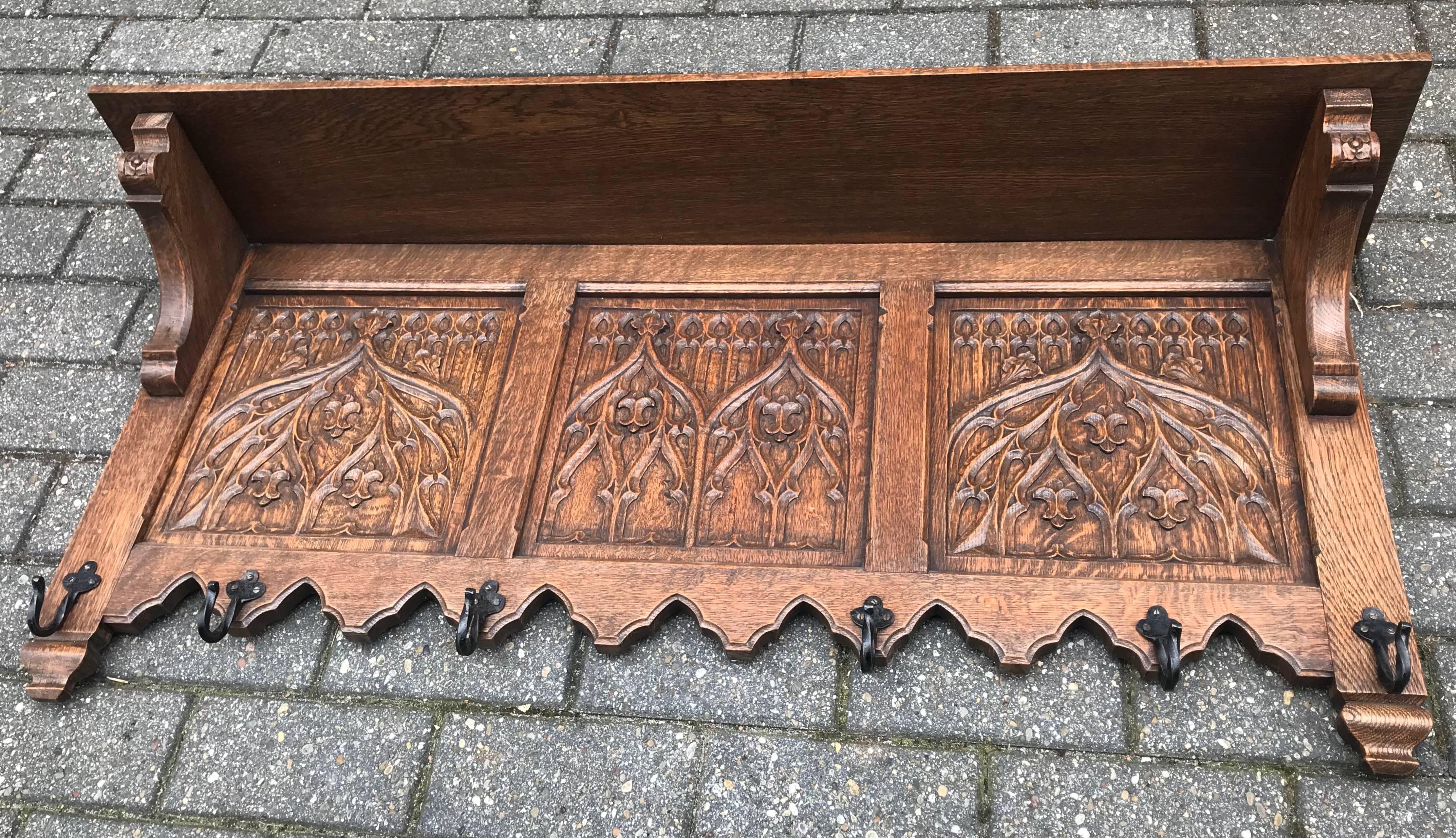 Wonderful craftsmanship solid oak Gothic Revival wall coat-rack.

Anyone who has ever visited a Gothic (Revival) church or other Gothic style building will immediately recognize the same stunning elements in this all handcrafted coat rack. The