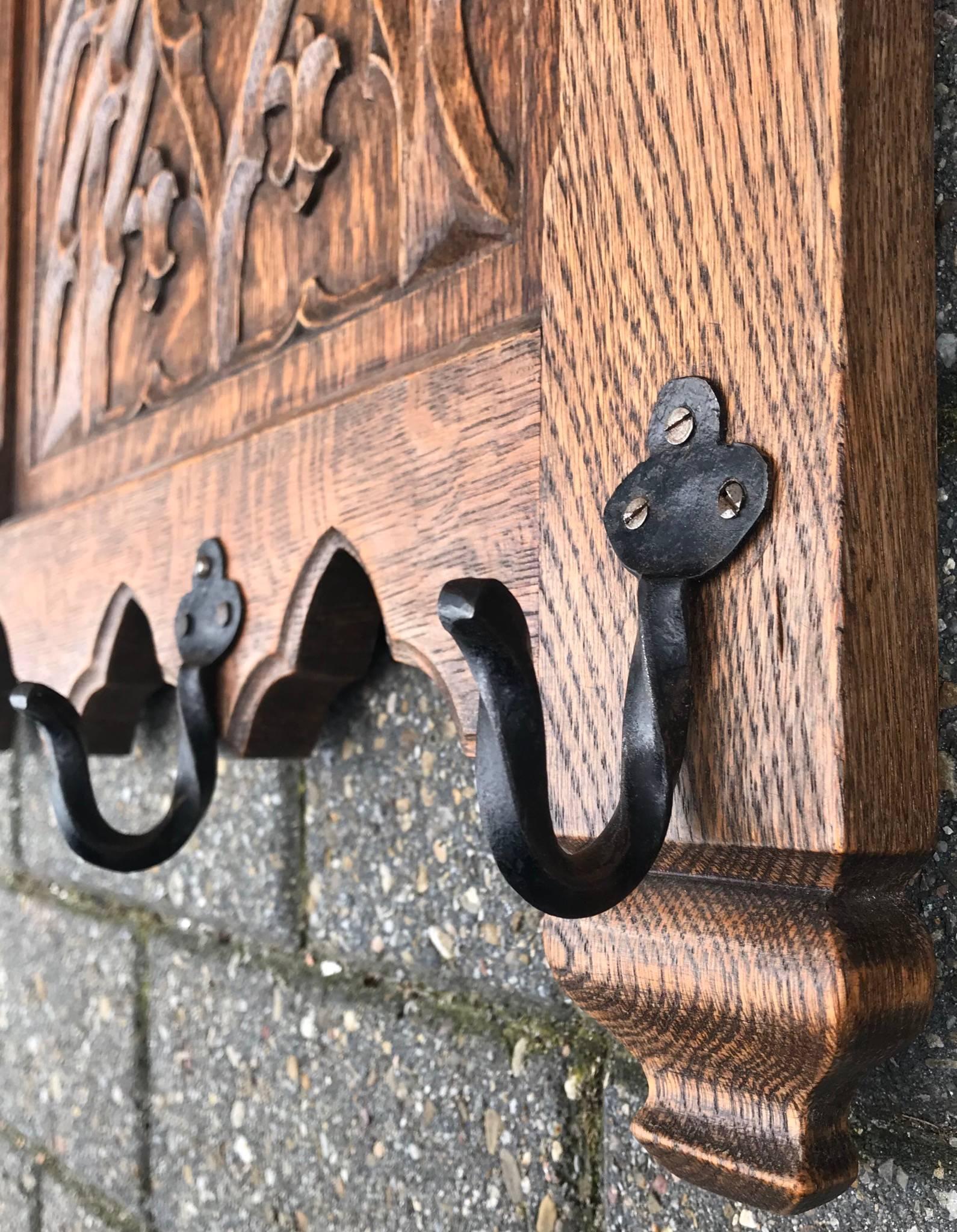20th Century Hand-Carved Gothic Revival Coat Rack with Iron Hooks & Church Window Panels