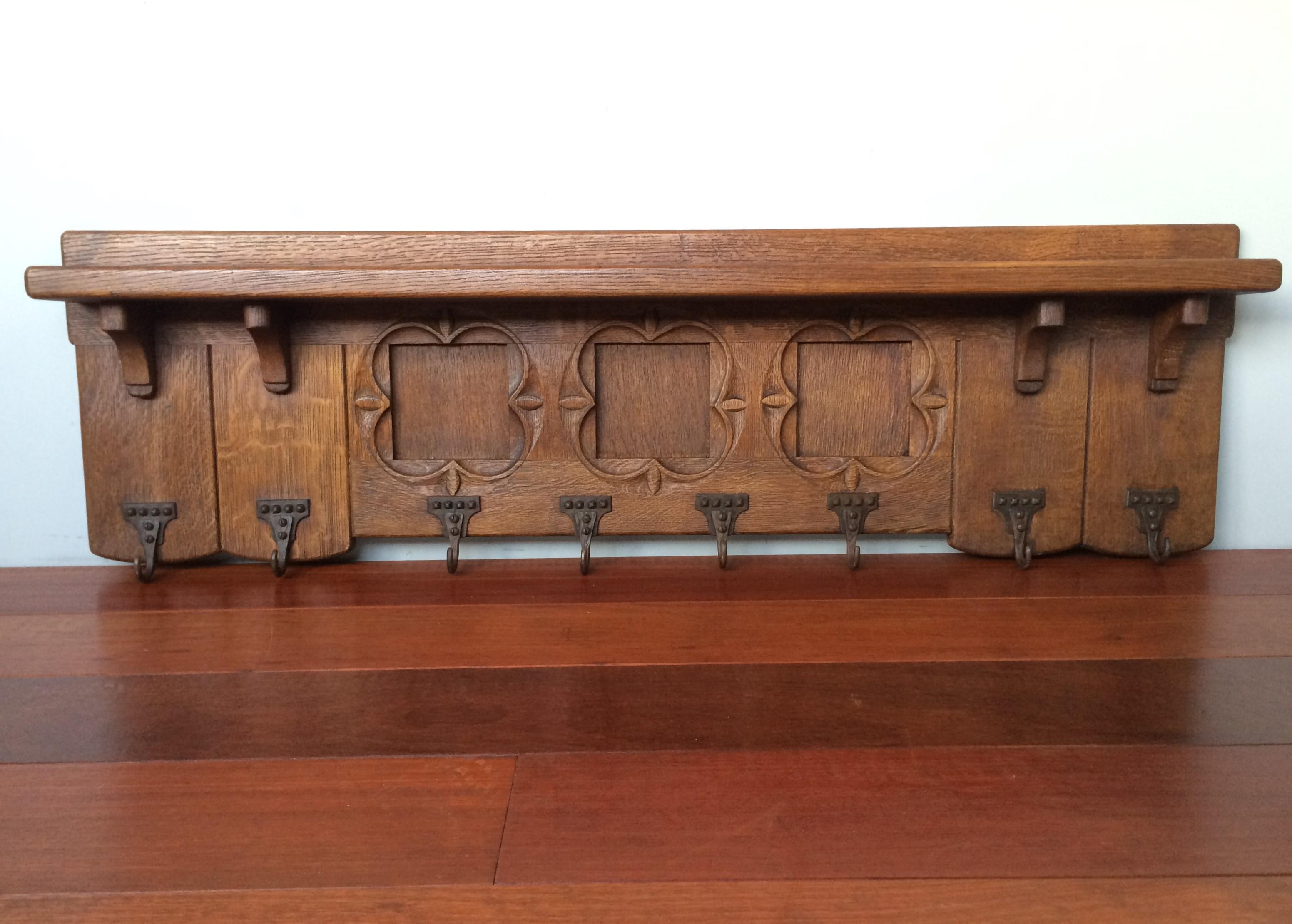 Large size, superb condition, wonderful craftsmanship, solid oak Gothic Revival wall coat rack.

Anyone who has ever visited a Gothic church or another Gothic style building will immediately recognize the perfect quatrefoil elements in this wall