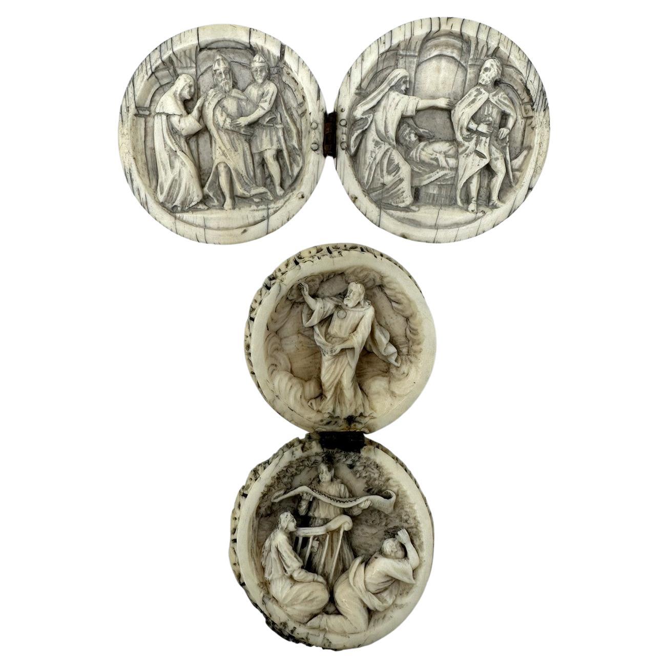 A Superb Example of a matched pair of Grand Tour hand carved Spheres of circular diptych form and French origin, mid Nineteenth Century.  

Each opening to reveal superb carvings interiors in relief depicting devotional scenes within interiors, with