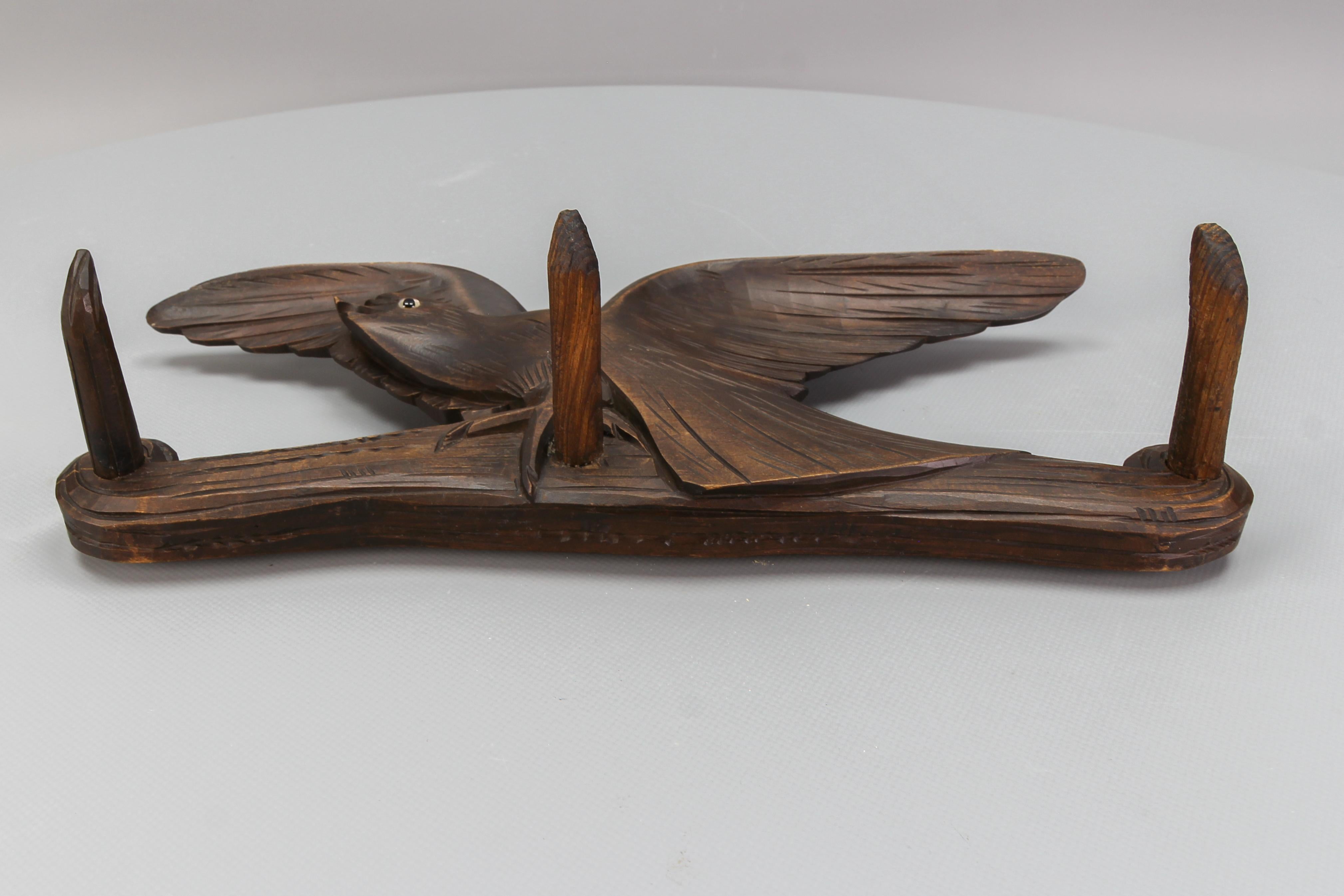 Early 20th Century Antique Hand-Carved Hat Rack with Bird and Three Wooden Hooks, Germany, Ca. 1920 For Sale