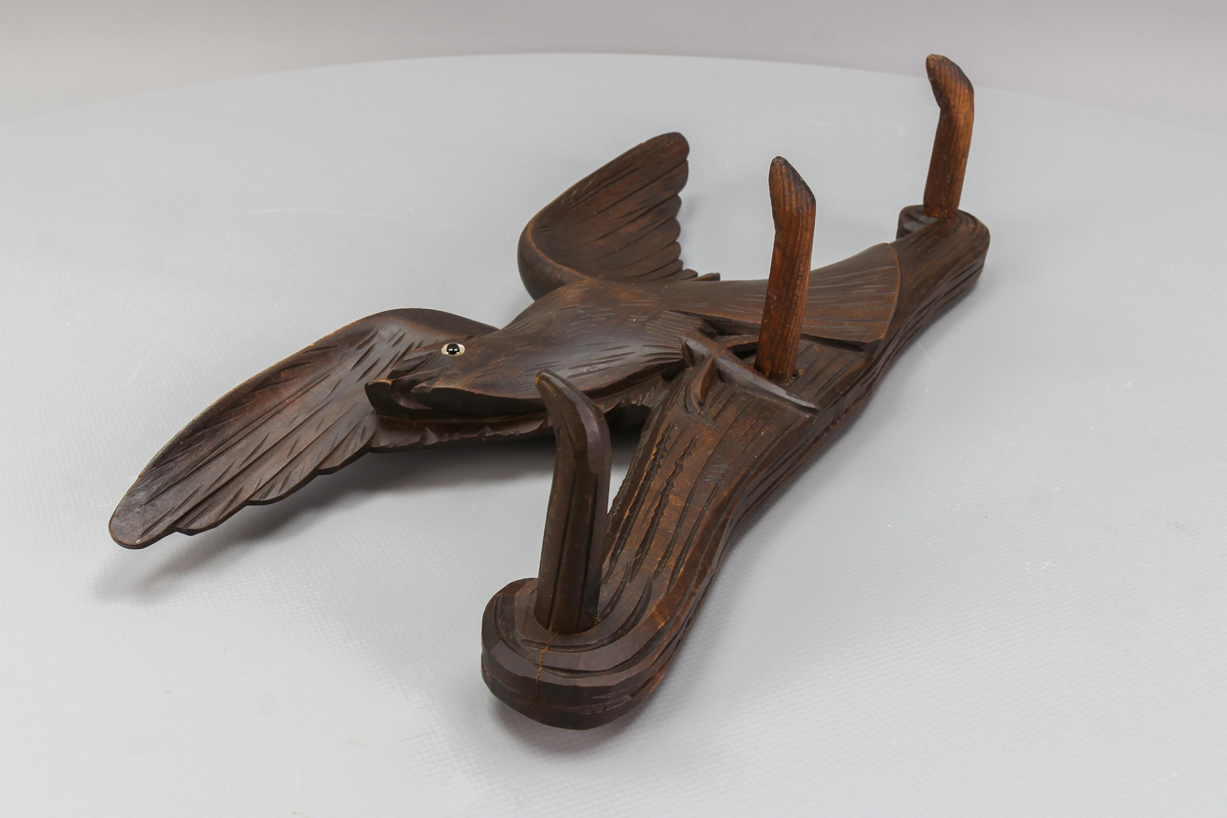 Metal Antique Hand-Carved Hat Rack with Bird and Three Wooden Hooks, Germany, Ca. 1920 For Sale