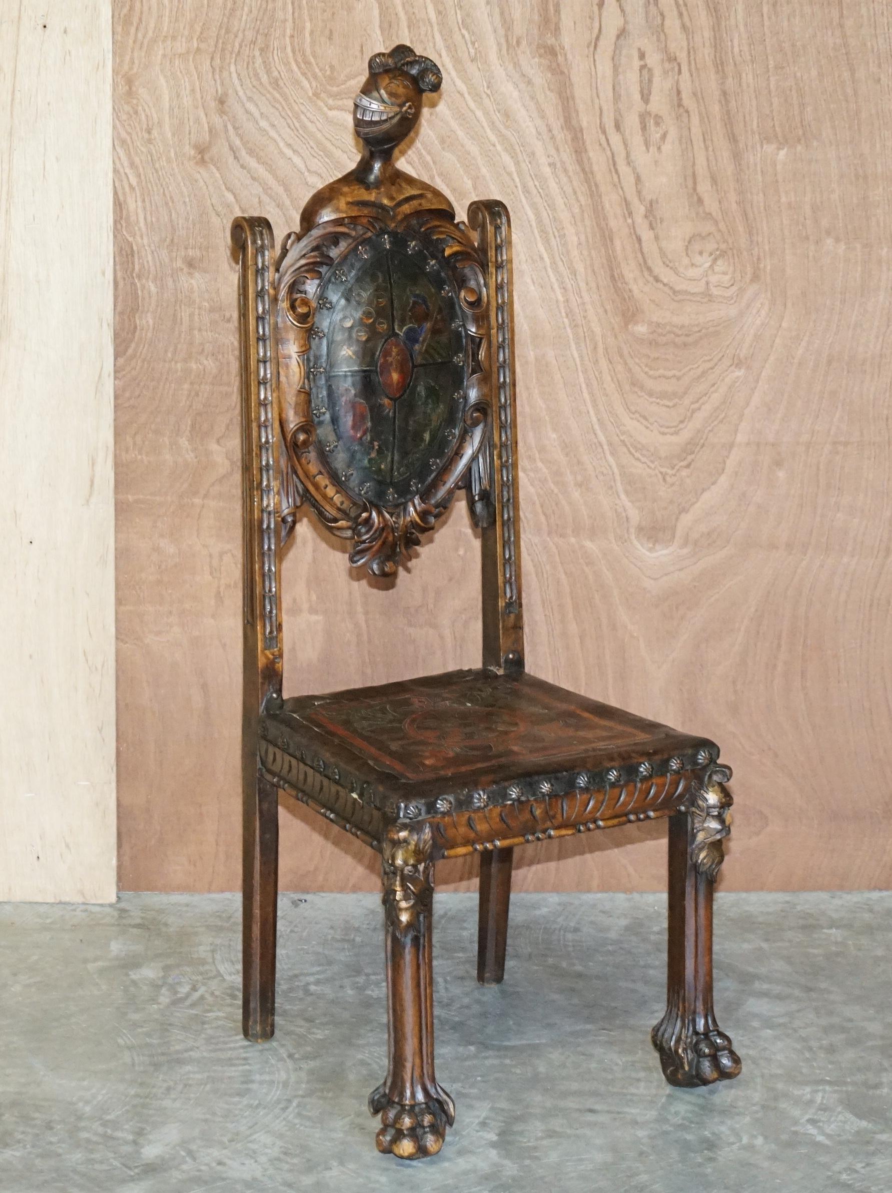 We are delighted to offer this lovely antique hand carved throne chair with embossed hand painted coat of arms to the back and Knights helmet to the top

What a chair! This is a fine piece of art furniture of ever I saw one. The frame is ornately