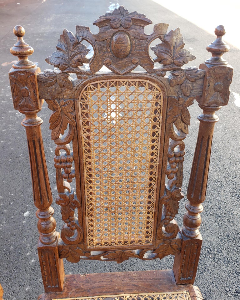 Antique Hand Carved Jacobean Oak and Cane Dining Chairs, Circa 1910s, a