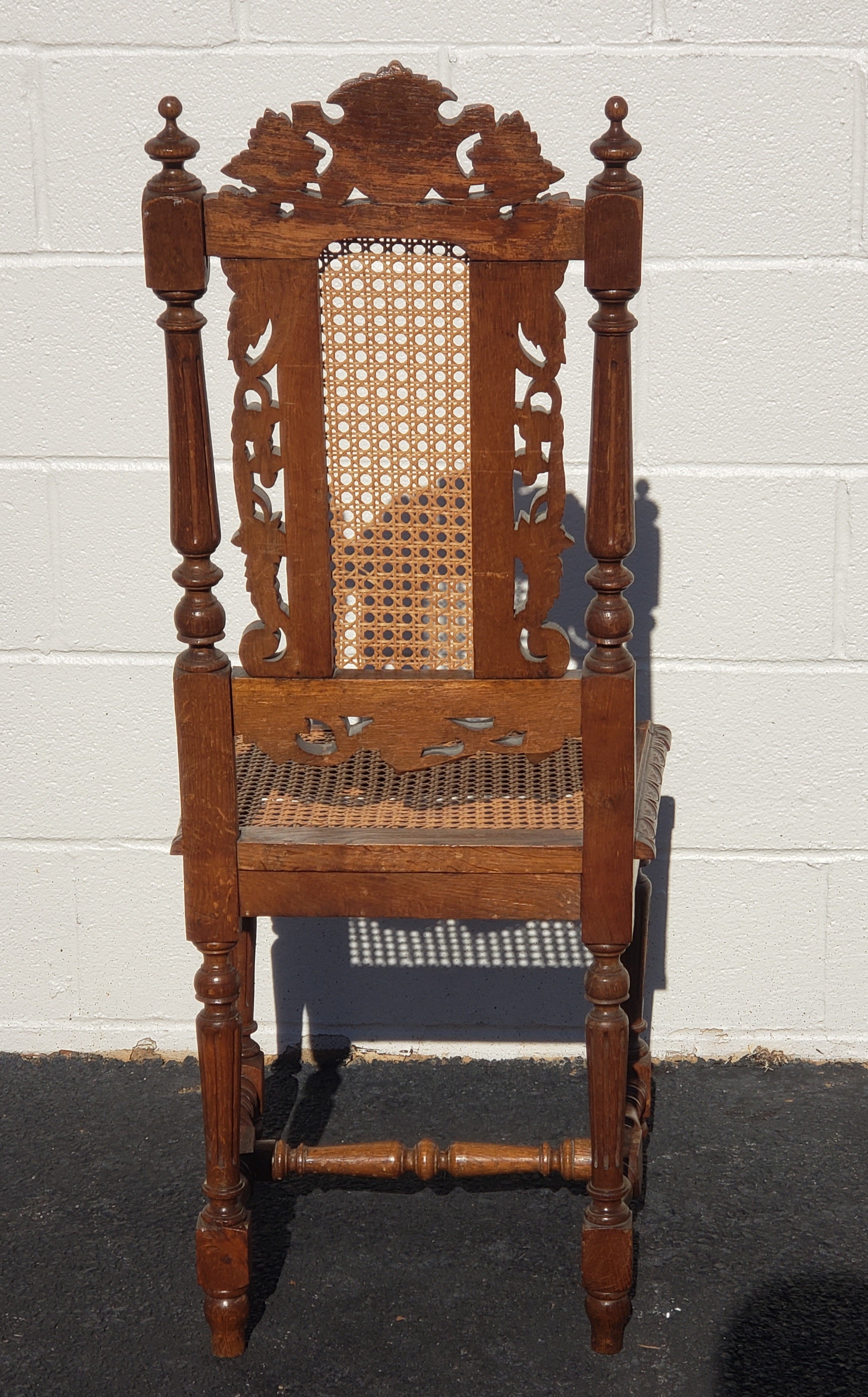American Antique Hand Carved Jacobean Oak and Cane Dining Chairs, Circa 1910s, a Set For Sale