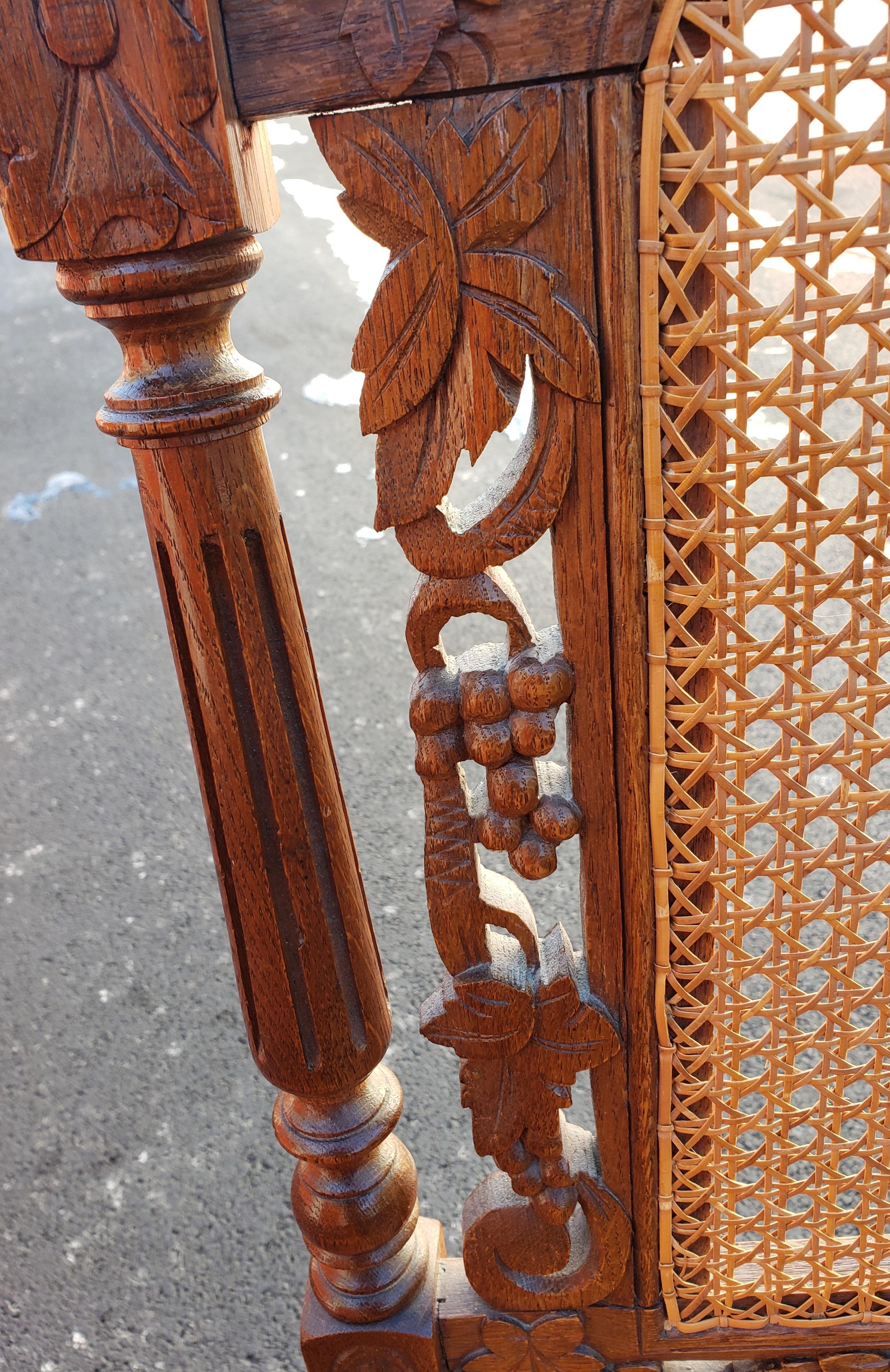 Hand-Carved Antique Hand Carved Jacobean Oak and Cane Dining Chairs, Circa 1910s, a Set For Sale