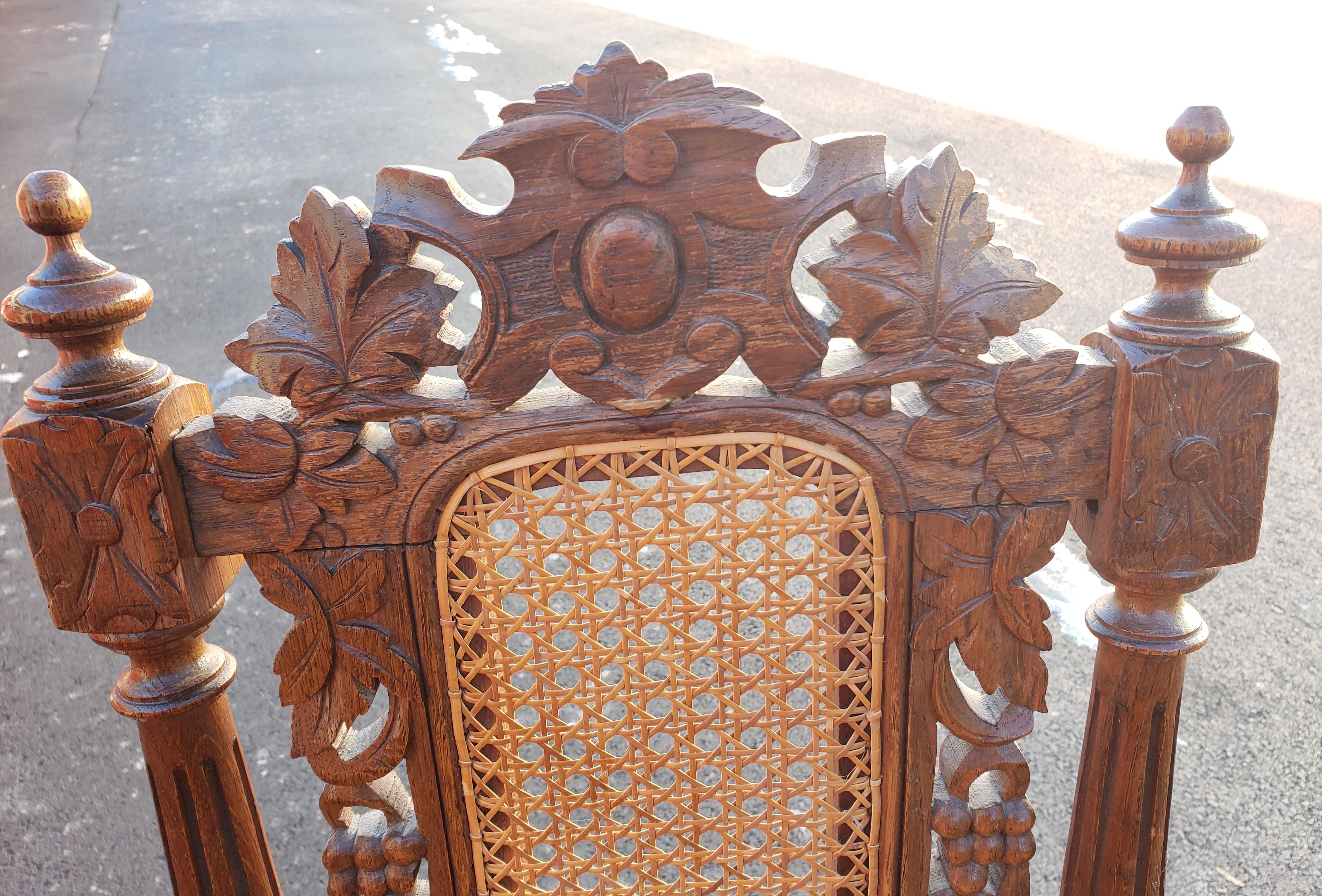 Antique Hand Carved Jacobean Oak and Cane Dining Chairs, Circa 1910s, a Set In Good Condition For Sale In Germantown, MD