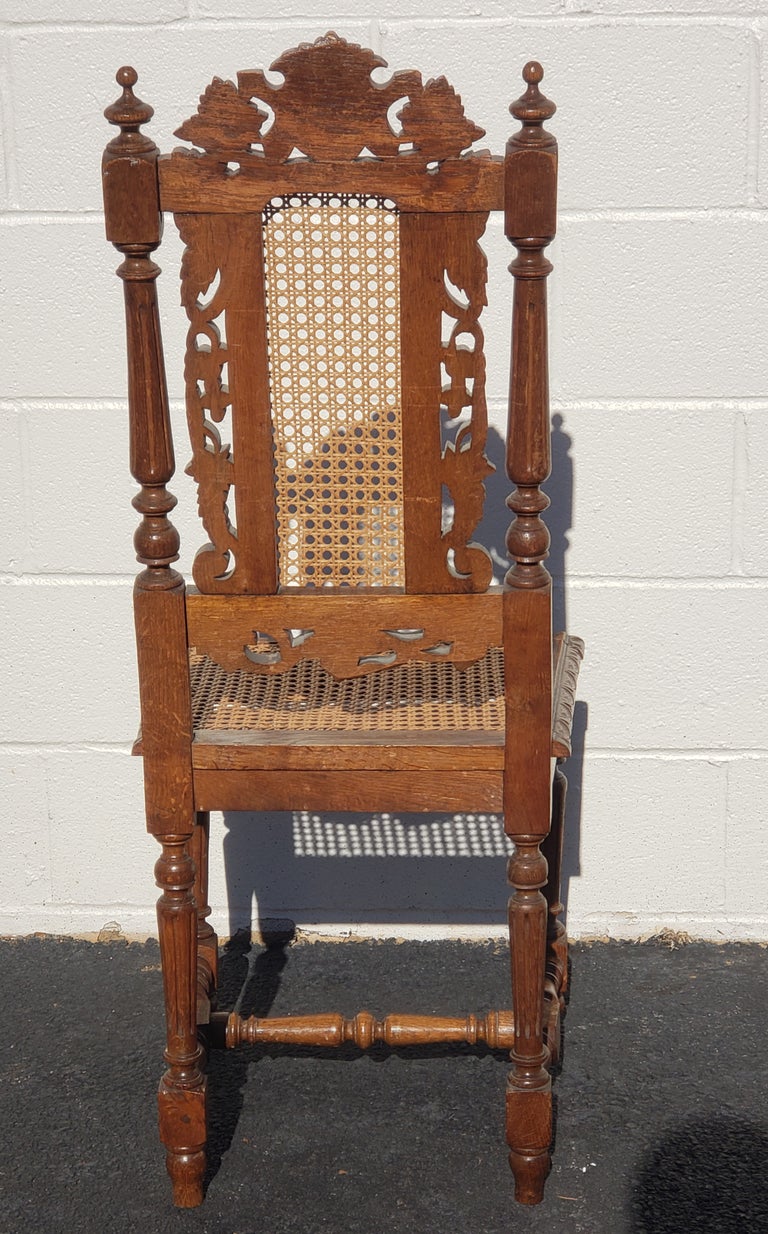 Antique Hand Carved Jacobean Oak and Cane Dining Chairs, Circa 1910s, a