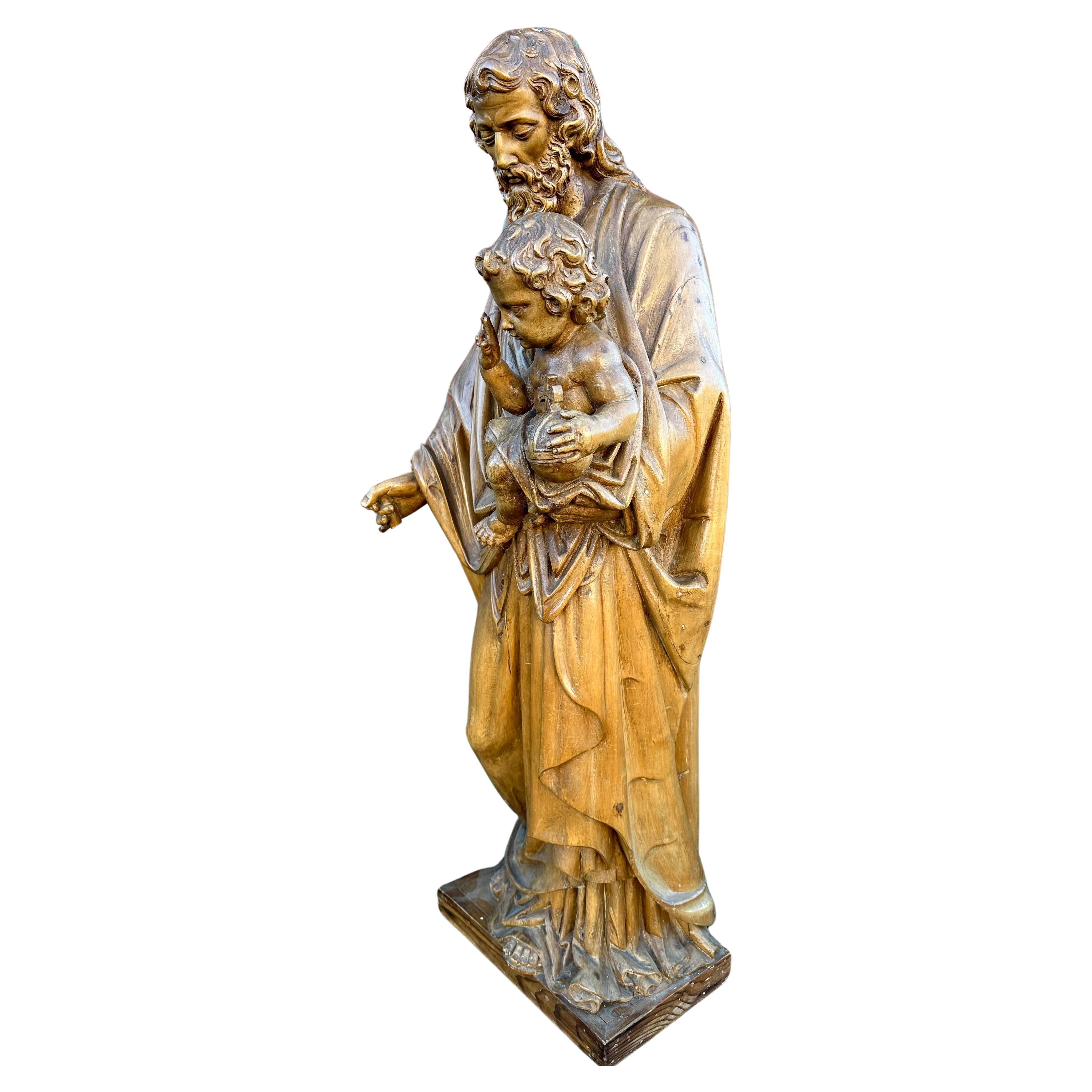 Große und hochwertige geschnitzte antike Skulptur von Joseph, der das Jesuskind hält.

Wenn Sie auf der Suche nach einem preiswerten religiösen Kunstwerk sind, dann könnte diese qualitätsvoll geschnitzte Kirchenreliquie schon bald Ihr Haus, Kloster