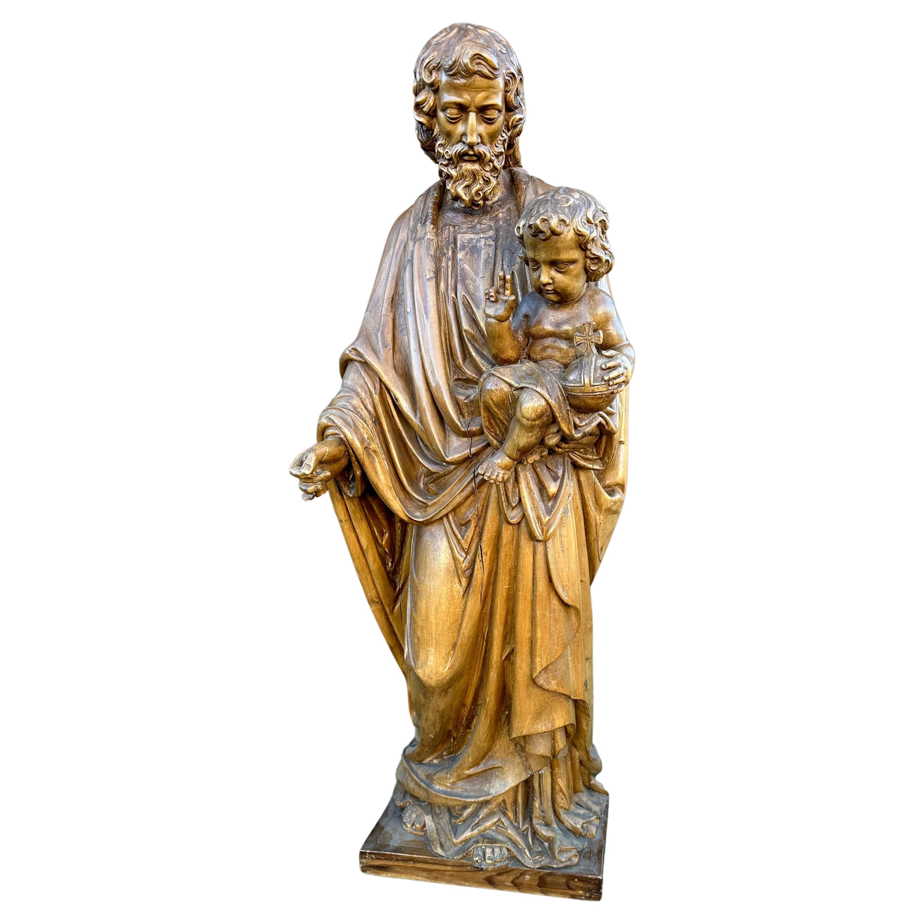 Antike handgeschnitzte großformatige Skulptur des Heiligen Joseph und des Kindes Jesus, Skulptur