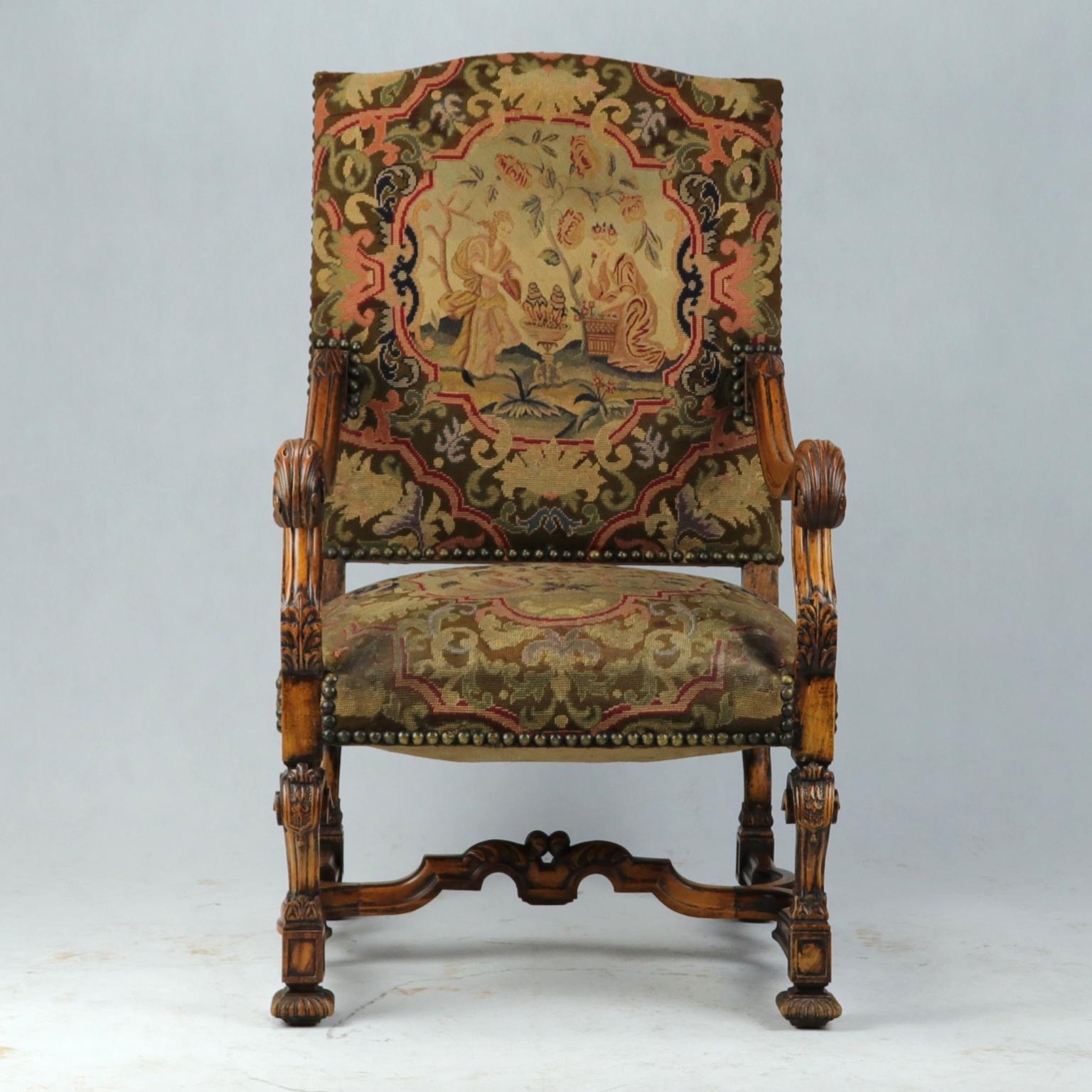 A very good large fruitwood Louis XIV armchair with slightly slanted rectangular high backrest and padded seat. With floral carved scrolled arms. On carved legs linked by a 'H' shaped stretcher. The chair upholstered in original fine wool tapestry.