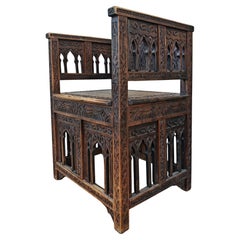 Antique hand-carved Moorish Armchair in solid oak, Spain 19th Century