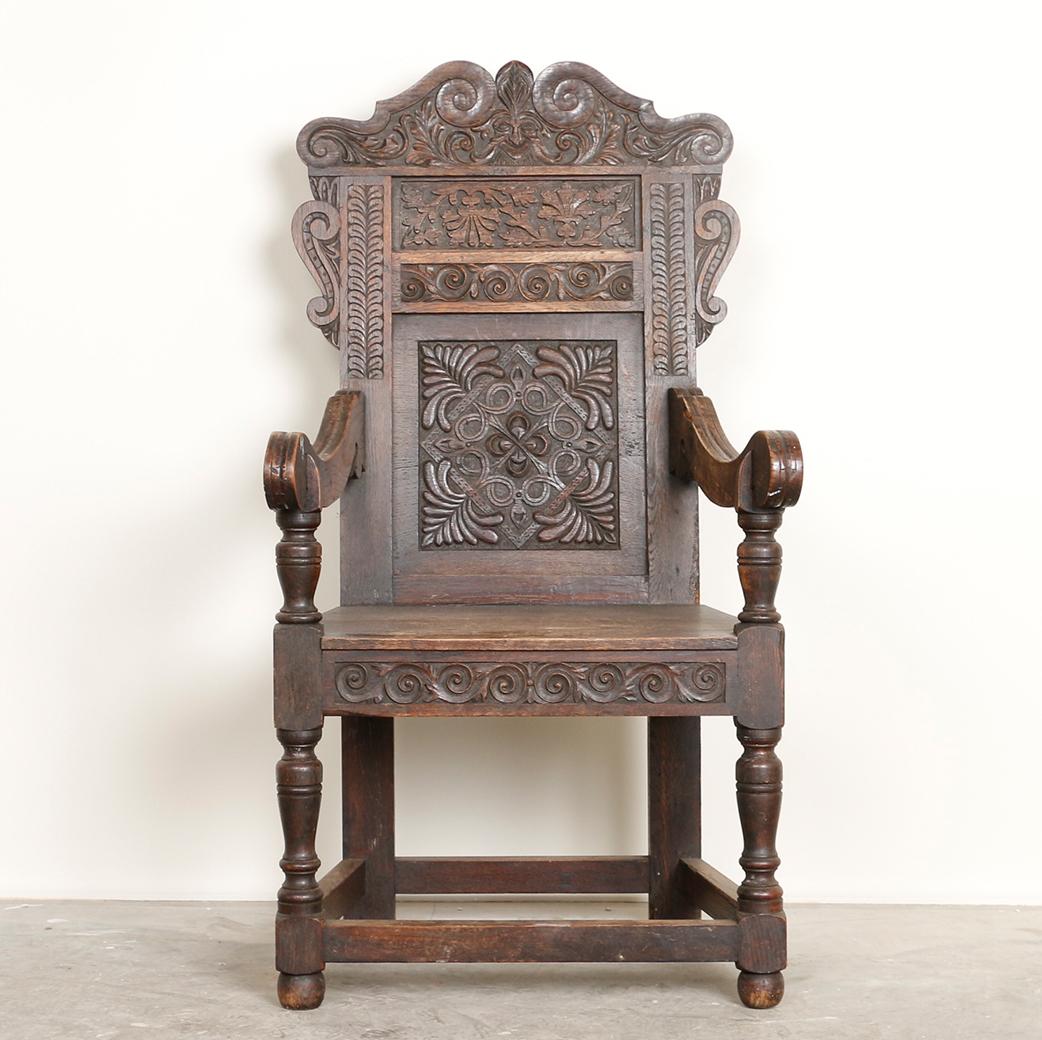 Even more impressive in person, this highly carved oak chair reveals the incredible craftsmanship of a time gone by. Notice the enchanting Norwegian stylized carving that quickly captures your gaze and draws you in. While it has dramatic visual